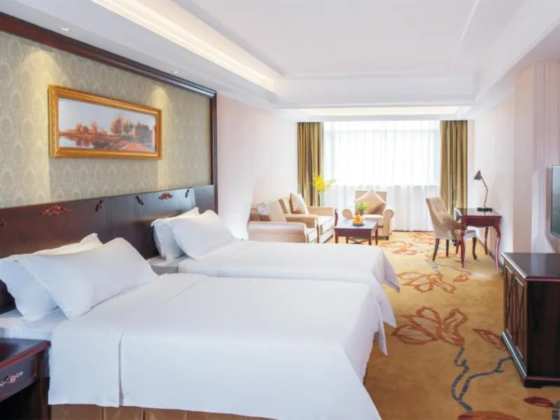 Bed in Vienna Hotel Shenzhen Shiyan Shilong Community