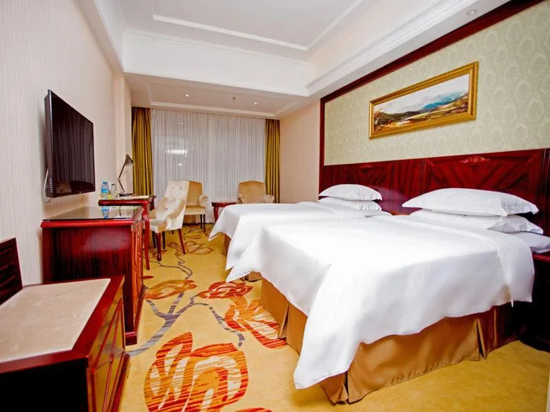Bed in Vienna Hotel Shenzhen Shiyan Shilong Community