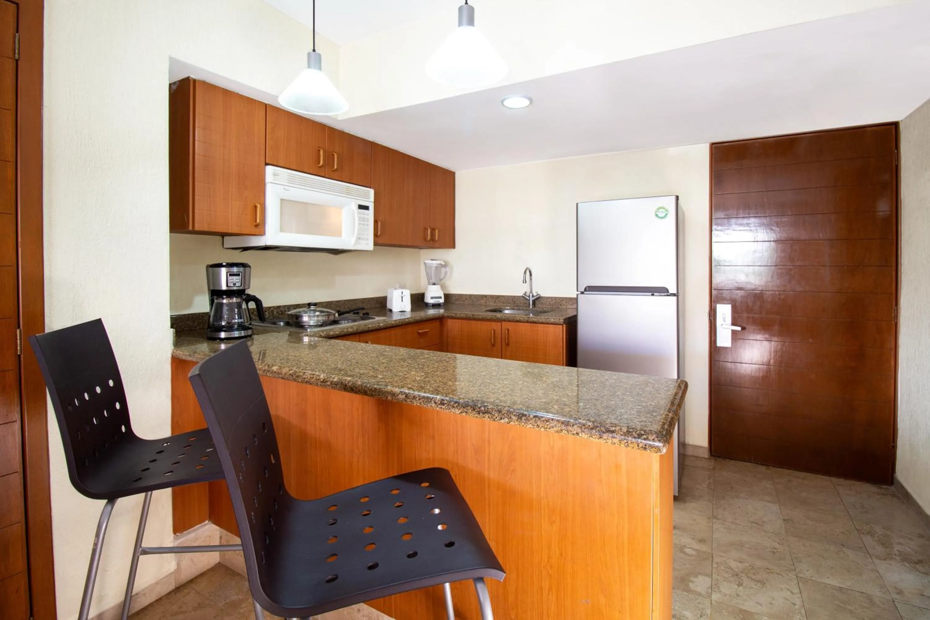 Kitchen or kitchenette in Plaza Pelicanos Grand Beach Resort All Inclusive