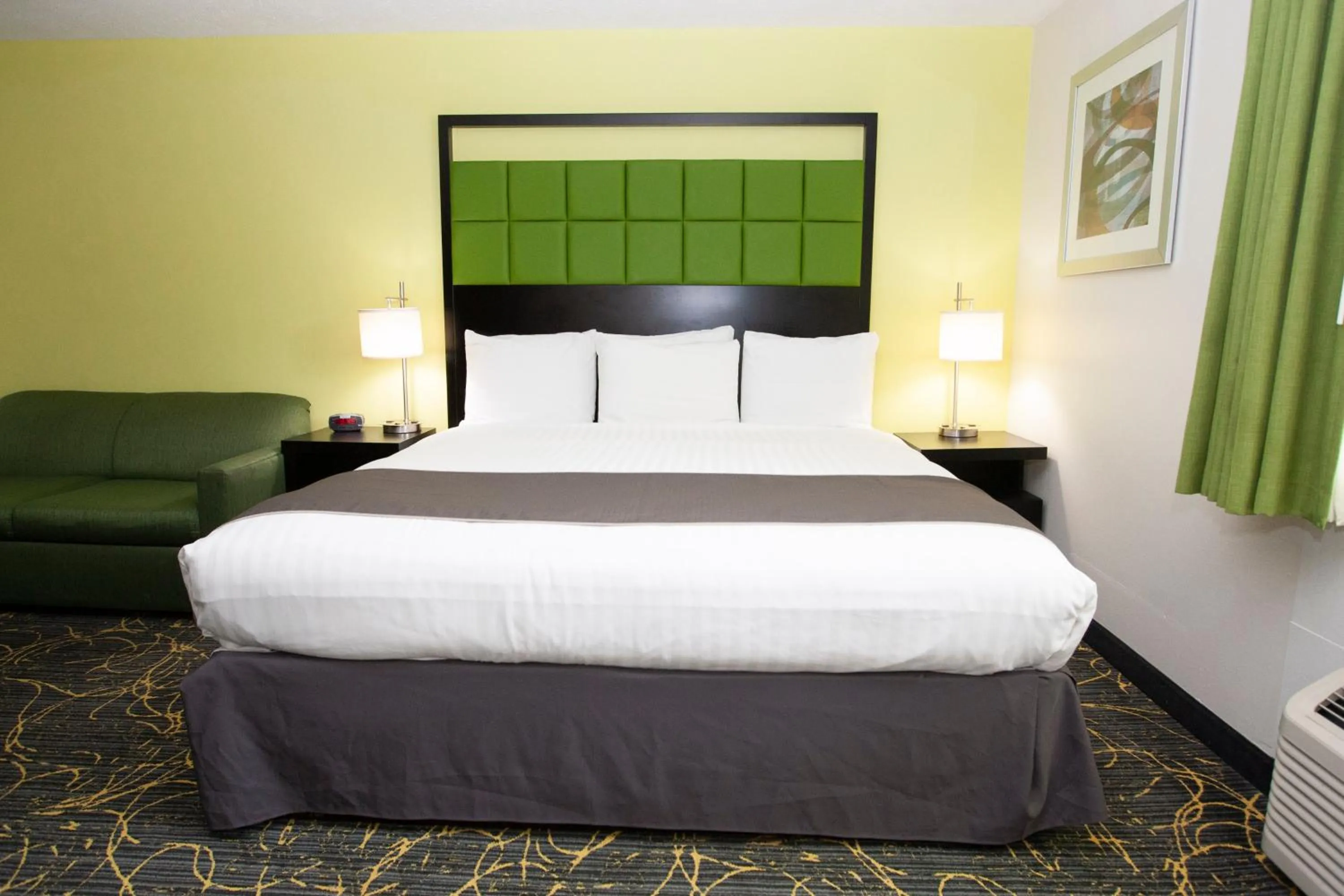 Bed in AmericInn and Suites by Wyndham Delafield-Waukesha-Milwaukee
