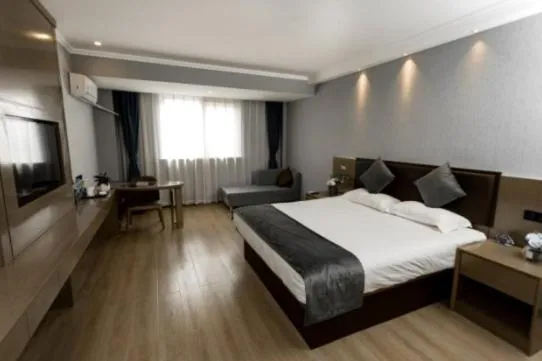 Bed in GreenTree Inn Jiangsu Suzhou Changshu Fuchunjiang International Qipeicheng Road Express Hotel