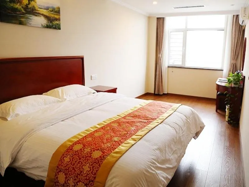 Bed in Greentree Tangshan Nanhu Jindi Business Hotel