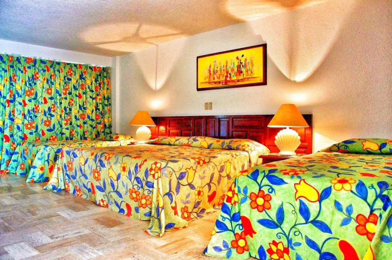 Bed in Sands Acapulco Hotel & Bungalows