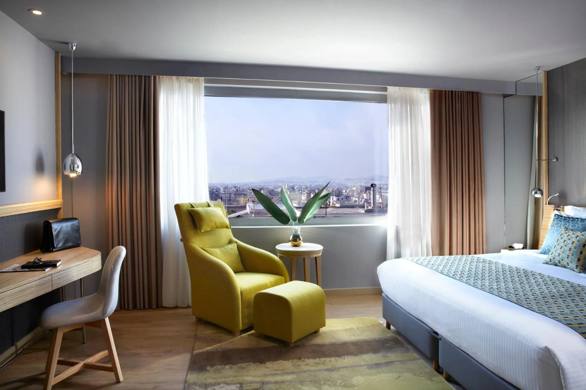 Seating area, Bed in Zeus Wyndham Grand Athens