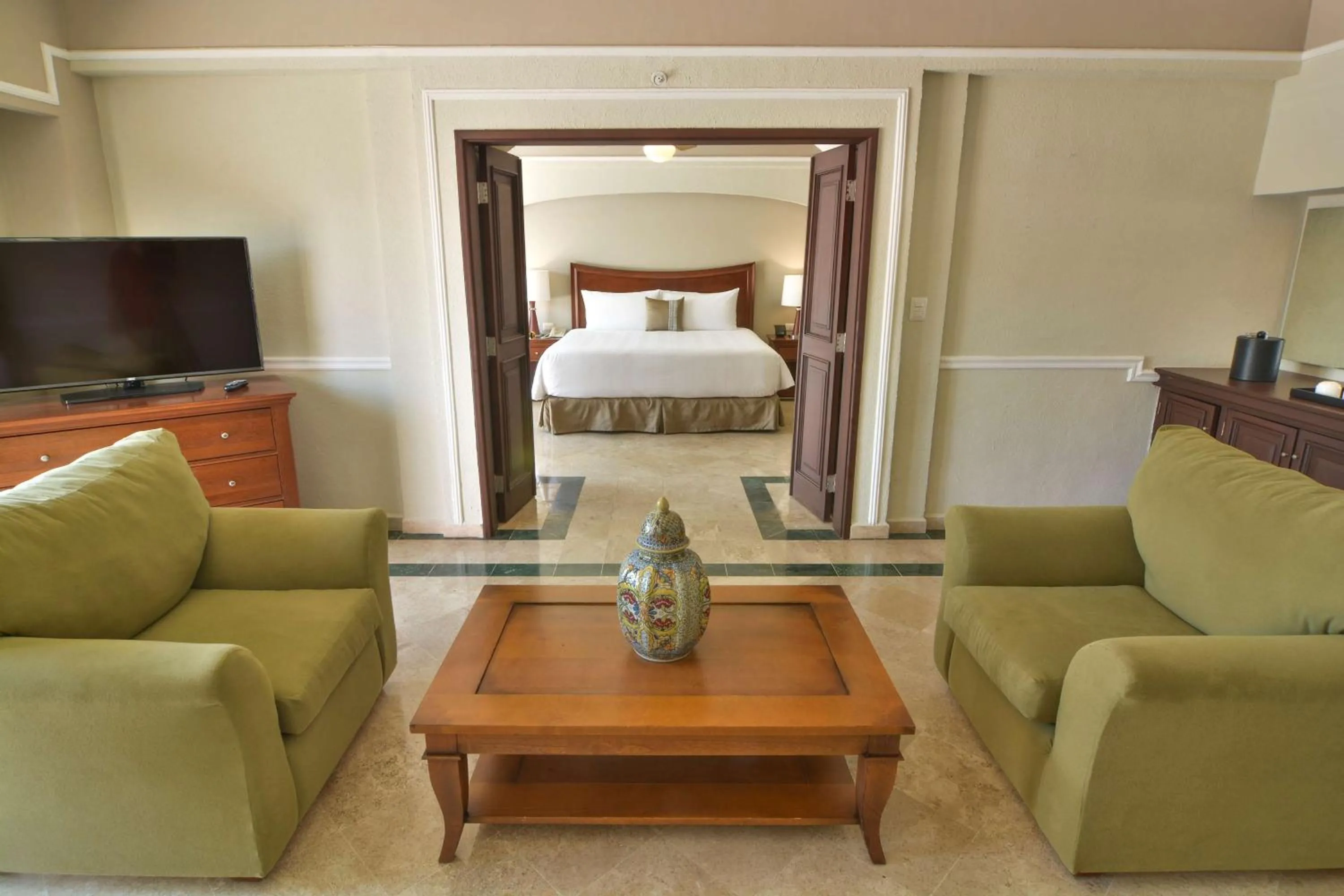 Living room, Bed in Villa Mercedes Curio Collection By Hilton