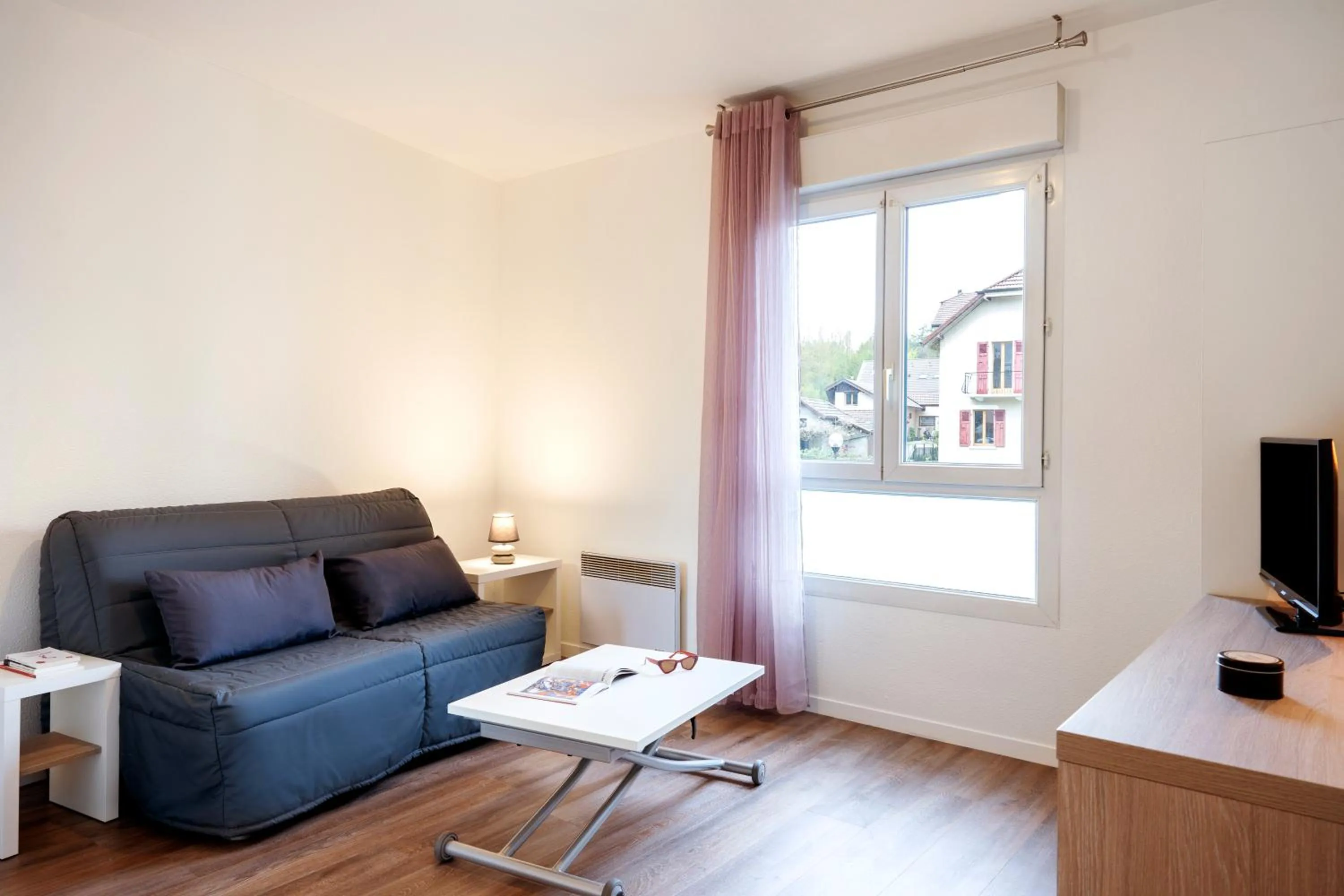 Seating area in Séjours & Affaires Annecy Le Pont Neuf