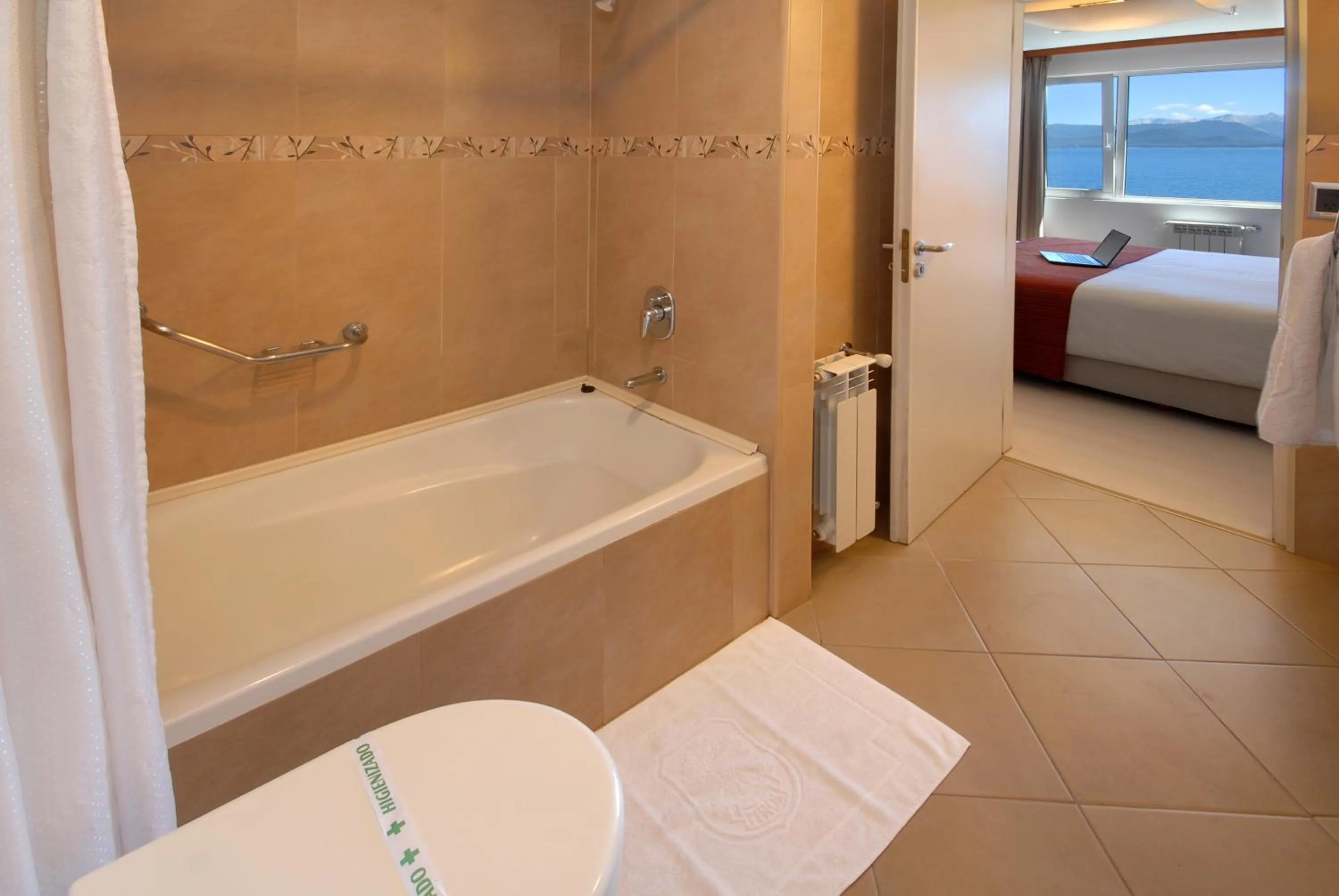 Bathroom, Bed in Hotel Tirol