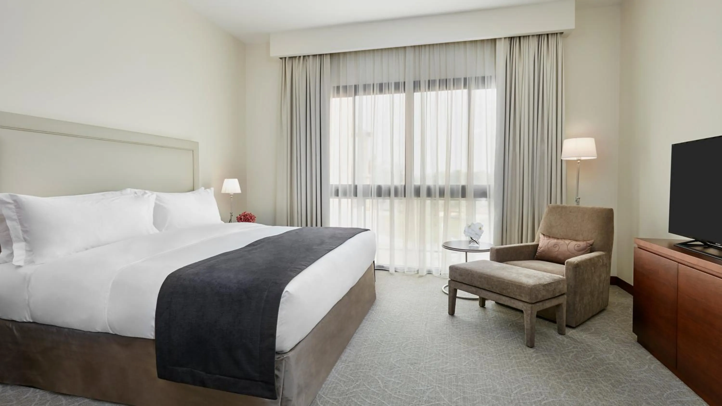 Photo of the whole room, Bed in InterContinental Hotels Doha Residences