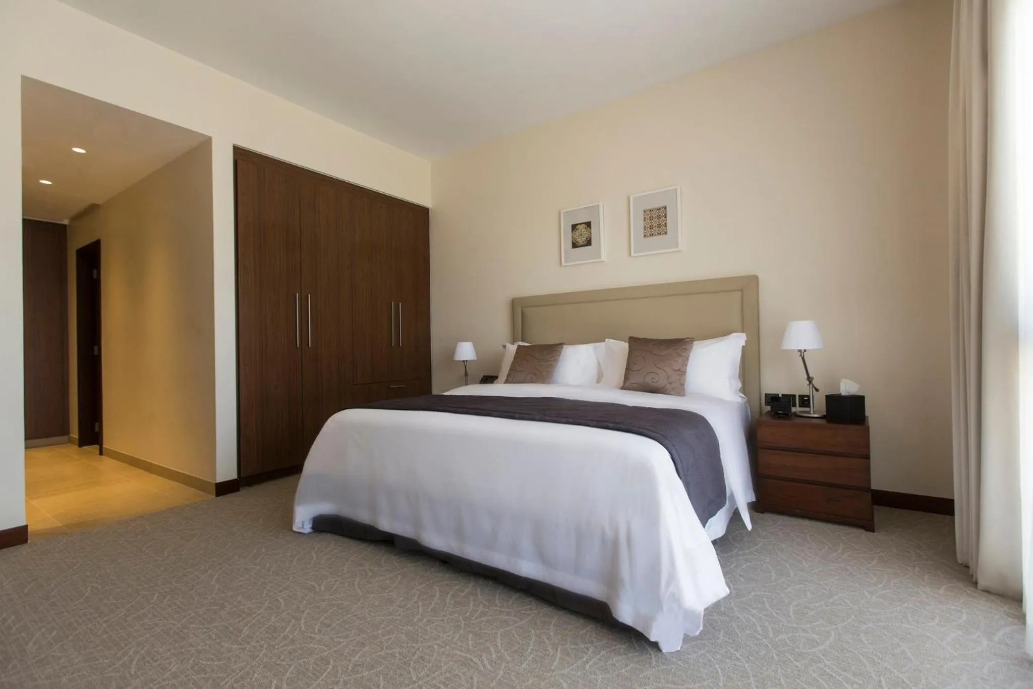 Photo of the whole room, Bed in InterContinental Hotels Doha Residences