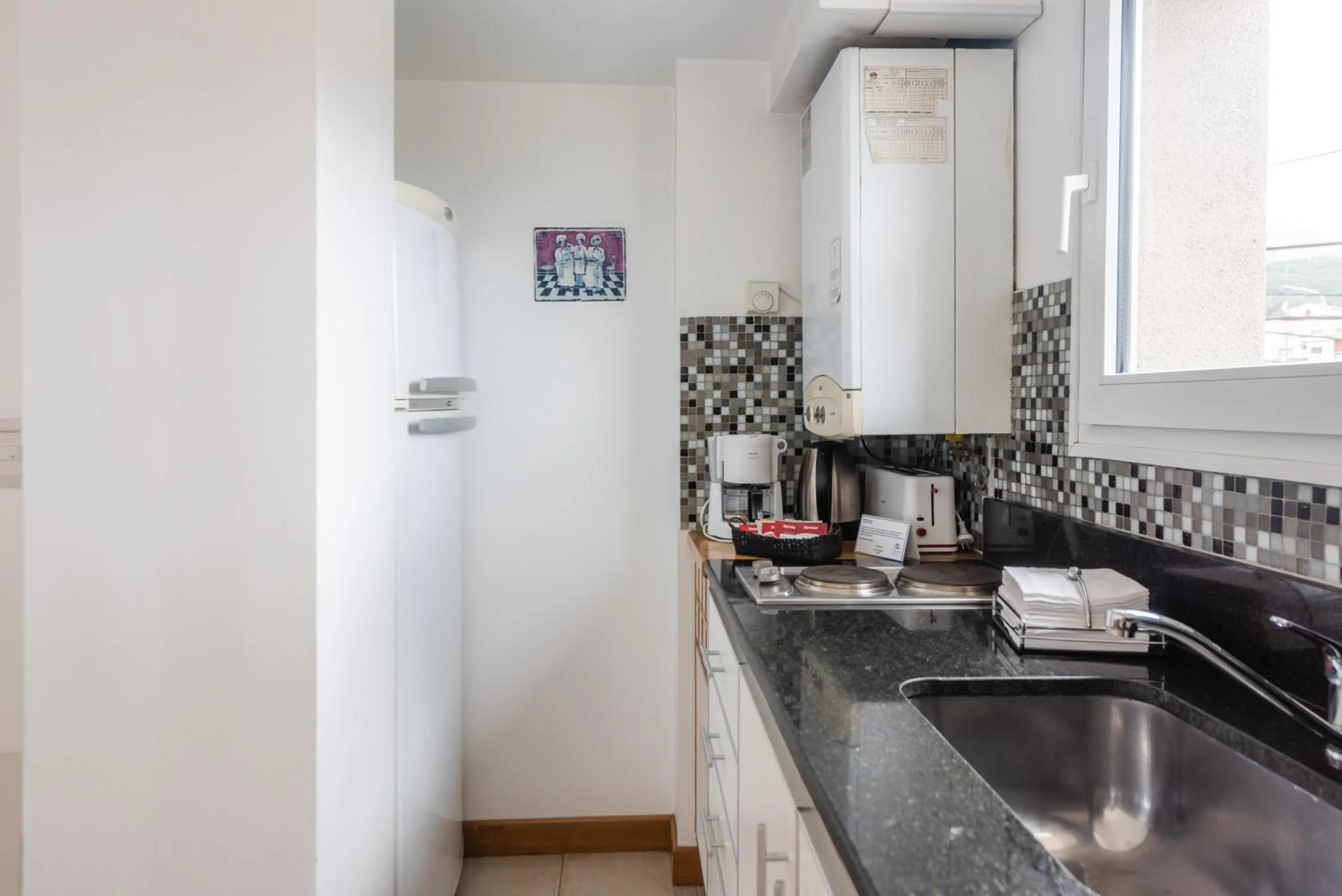 Kitchen or kitchenette in Cilene del Faro Suites & Spa