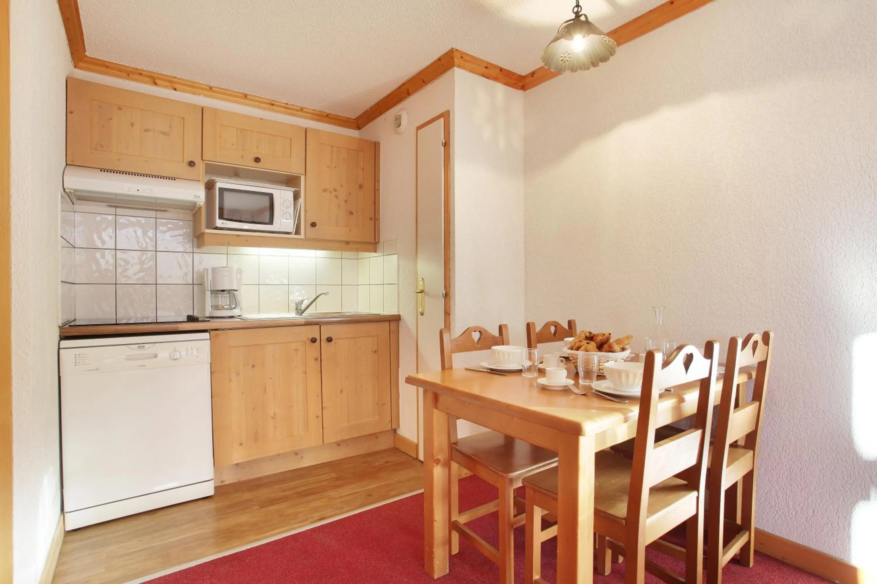 Kitchen or kitchenette in Résidence Odalys Le Village