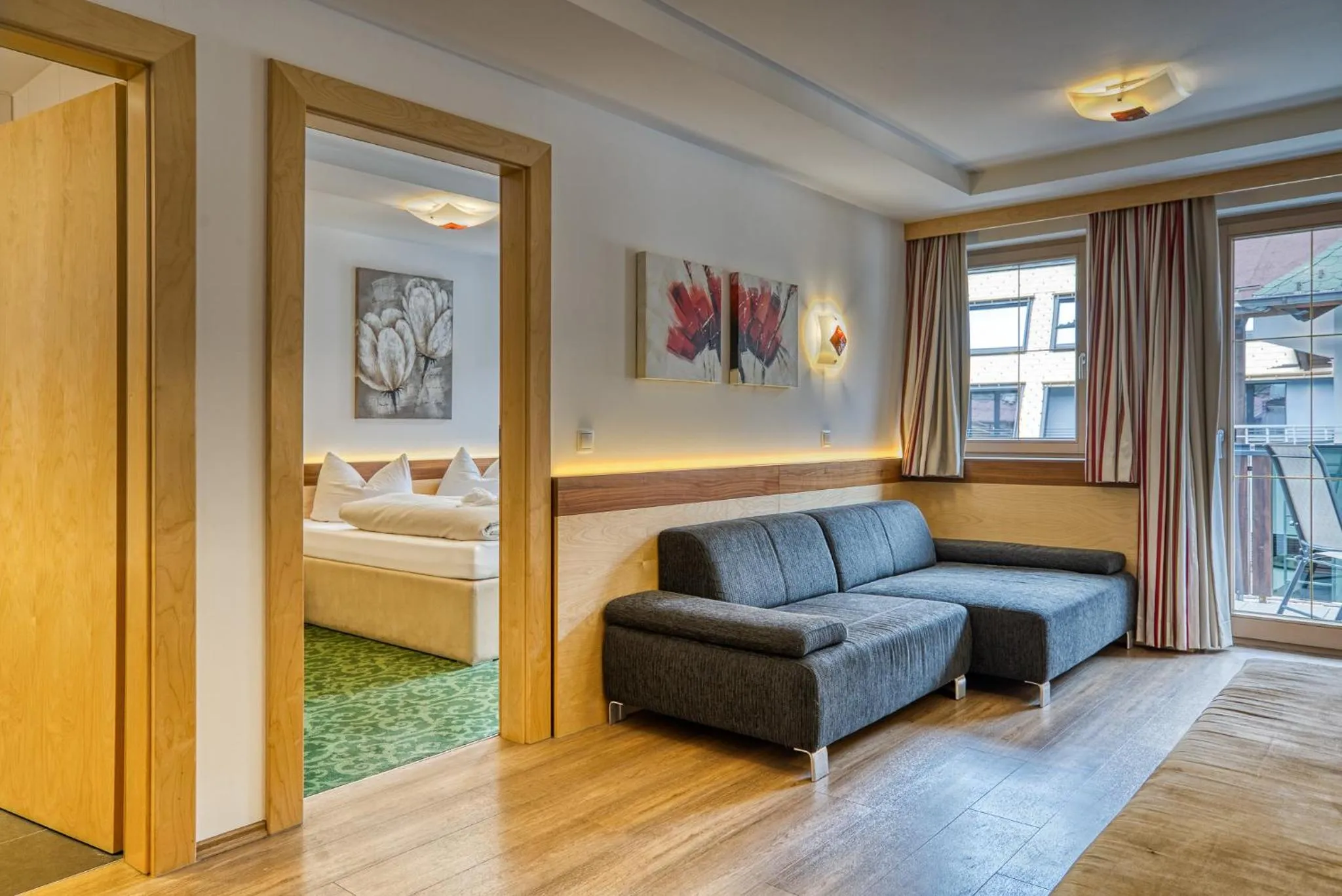 Living room, Bed in SonnenHOF hotel gerlos centrum