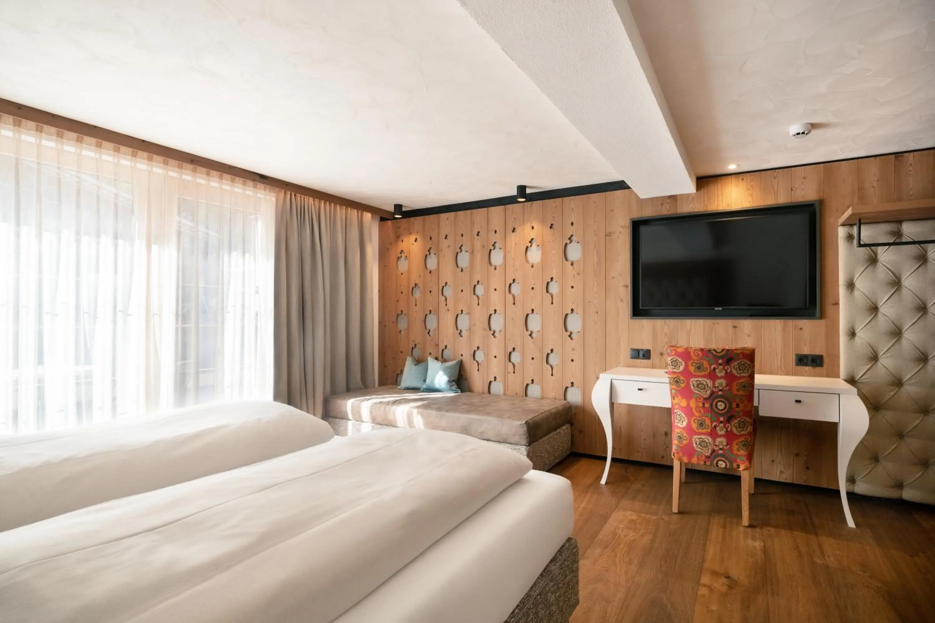 Photo of the whole room, Bed in SonnenHOF hotel gerlos centrum