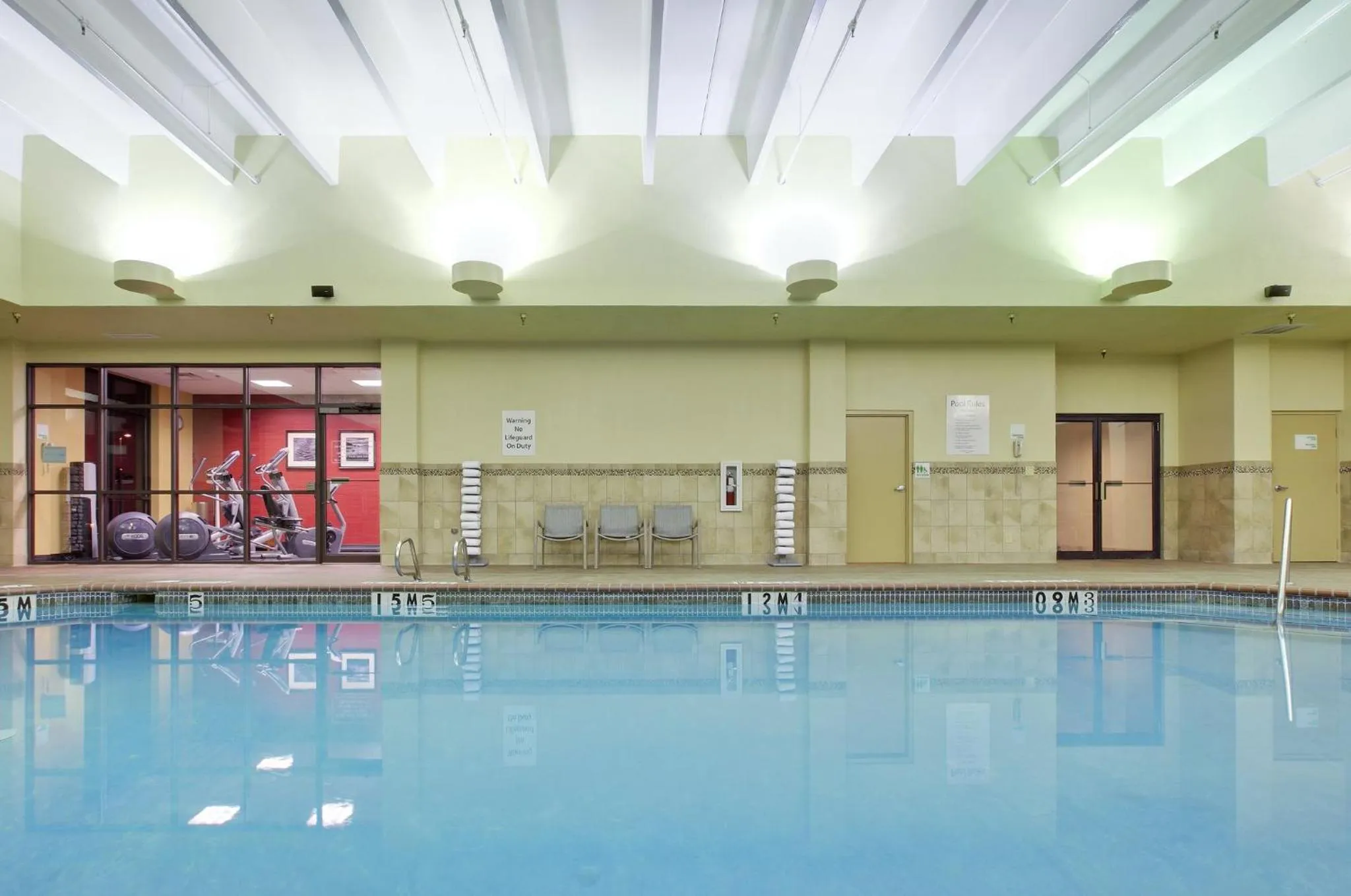 Swimming pool in Holiday Inn Springdale-Fayetteville Area by IHG