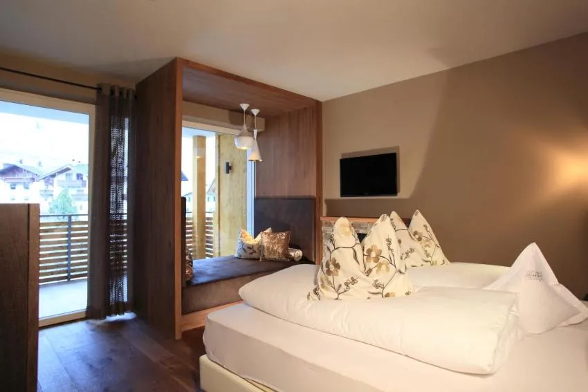 Photo of the whole room, Bed in Stroblhof Active Family Spa Resort