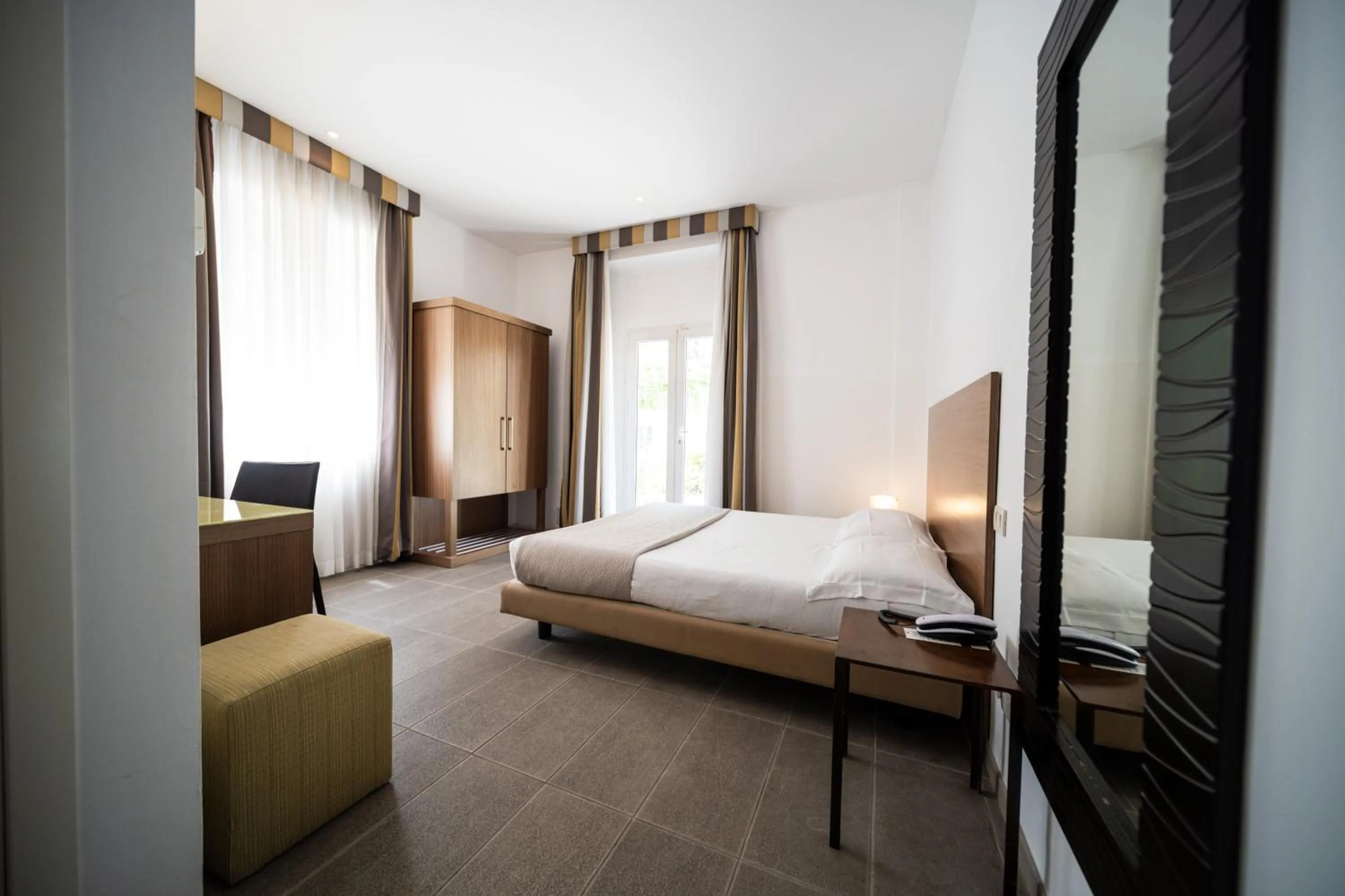 Photo of the whole room, Bed in Hotel Trieste