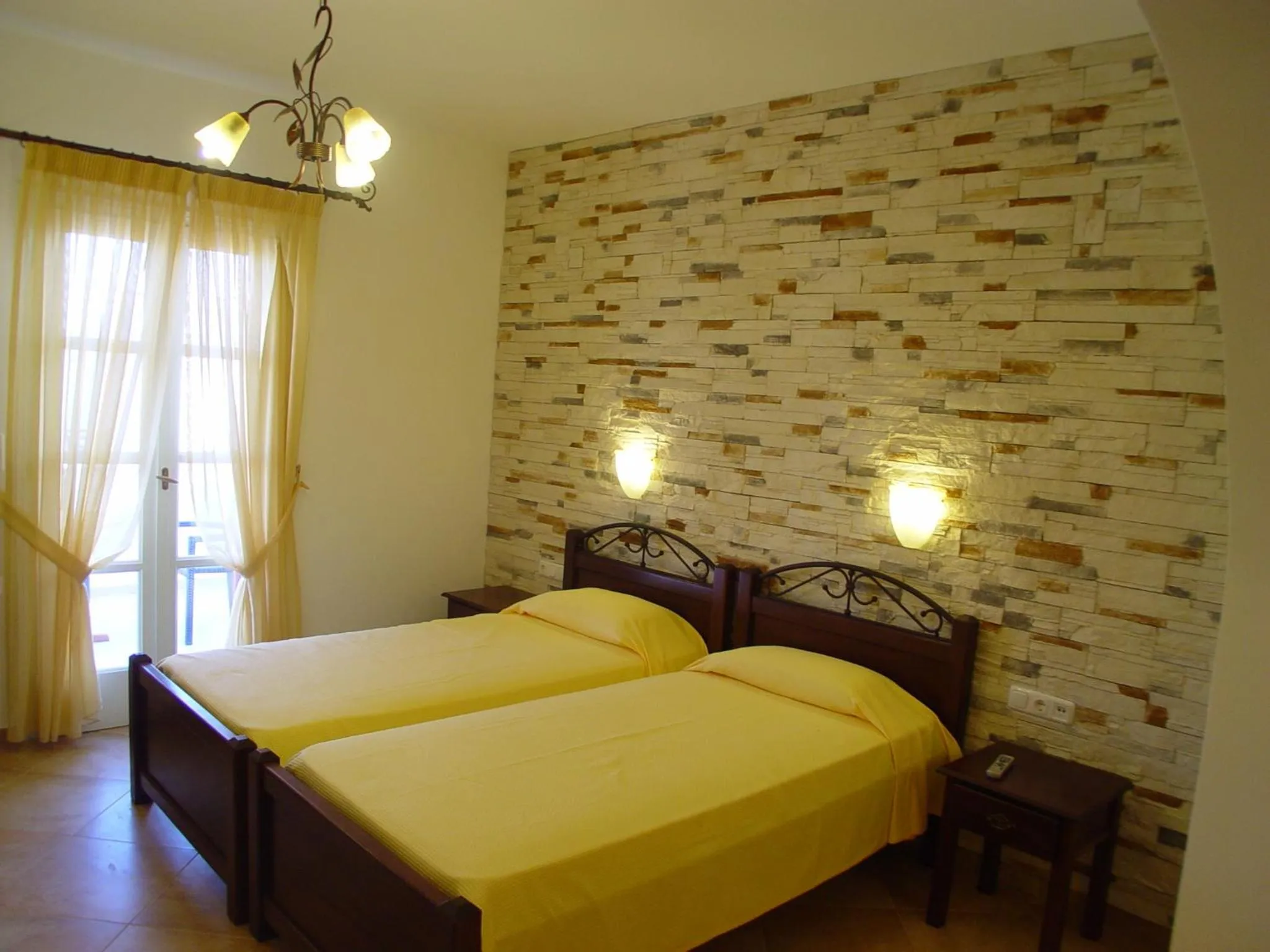 Bed in Annita's Village Hotel