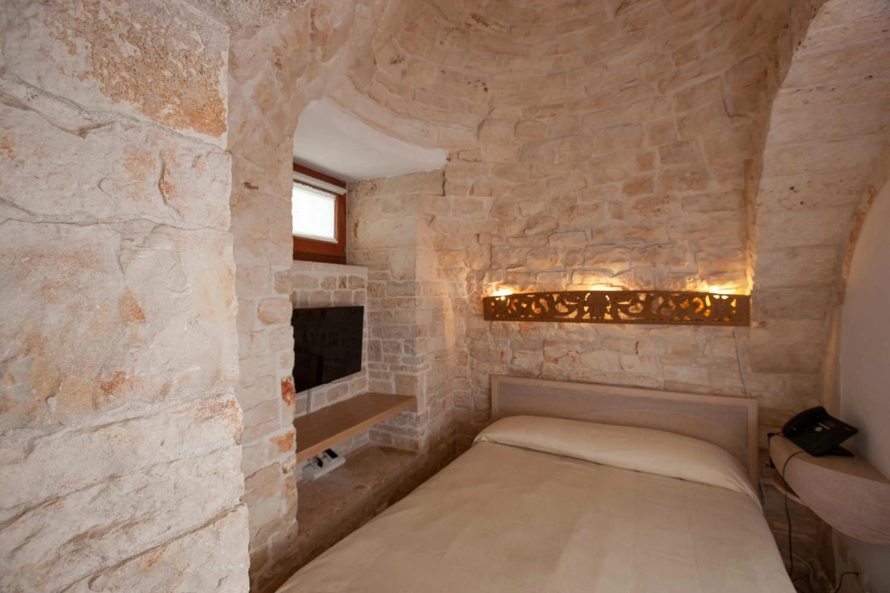 Bed in Le Alcove - Luxury Hotel nei Trulli