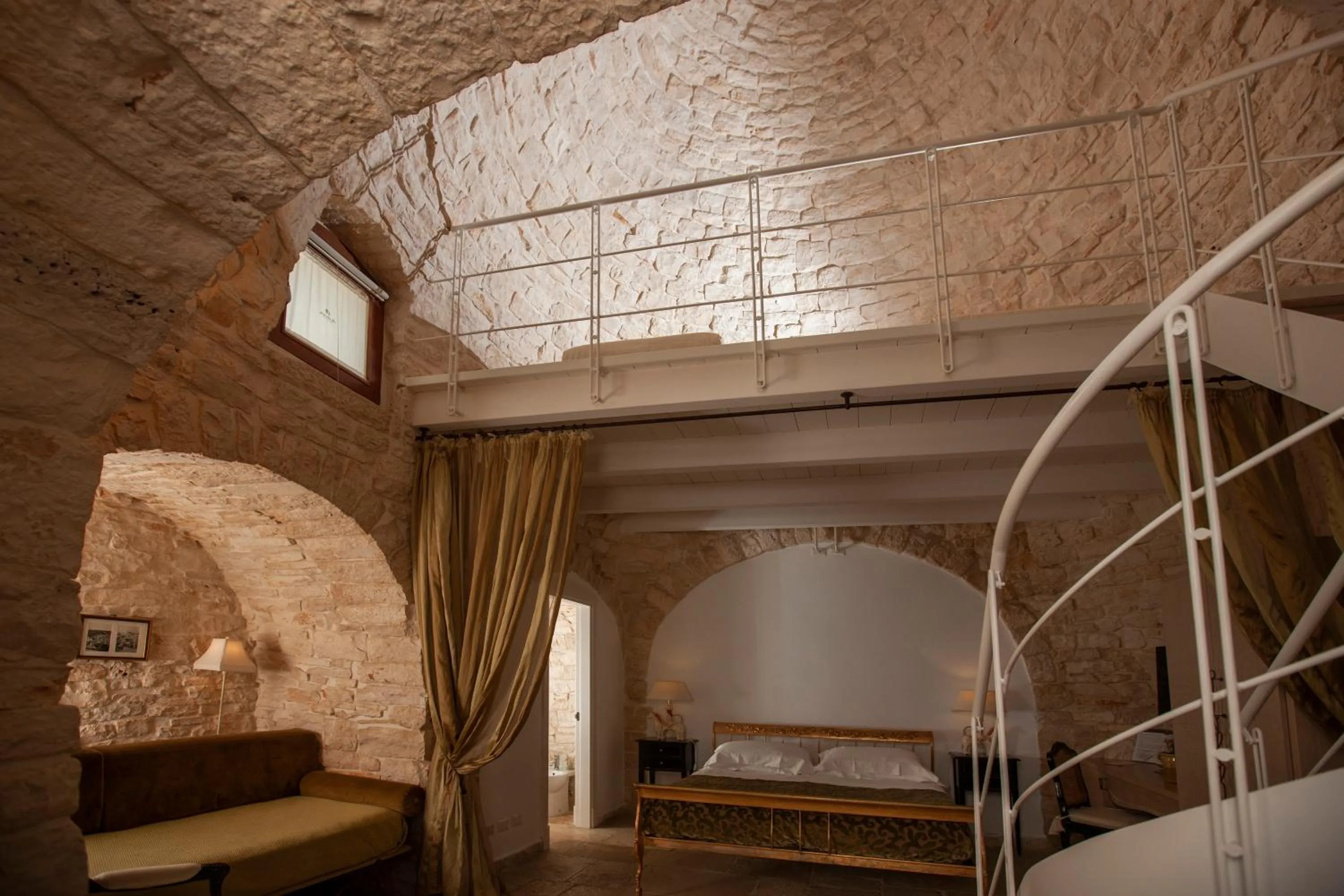 Bed in Le Alcove - Luxury Hotel nei Trulli