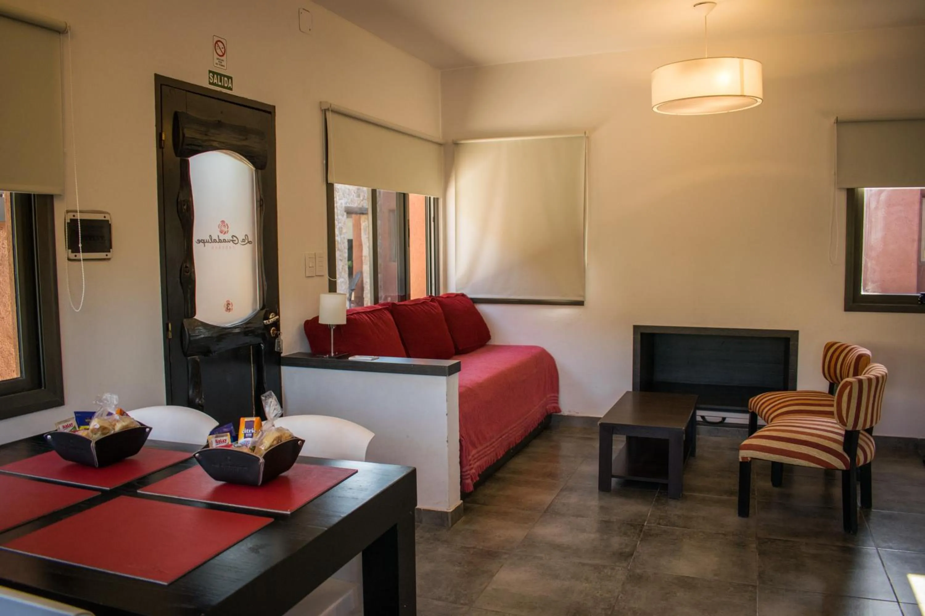 Living room, Bed in La Guadalupe Cabañas