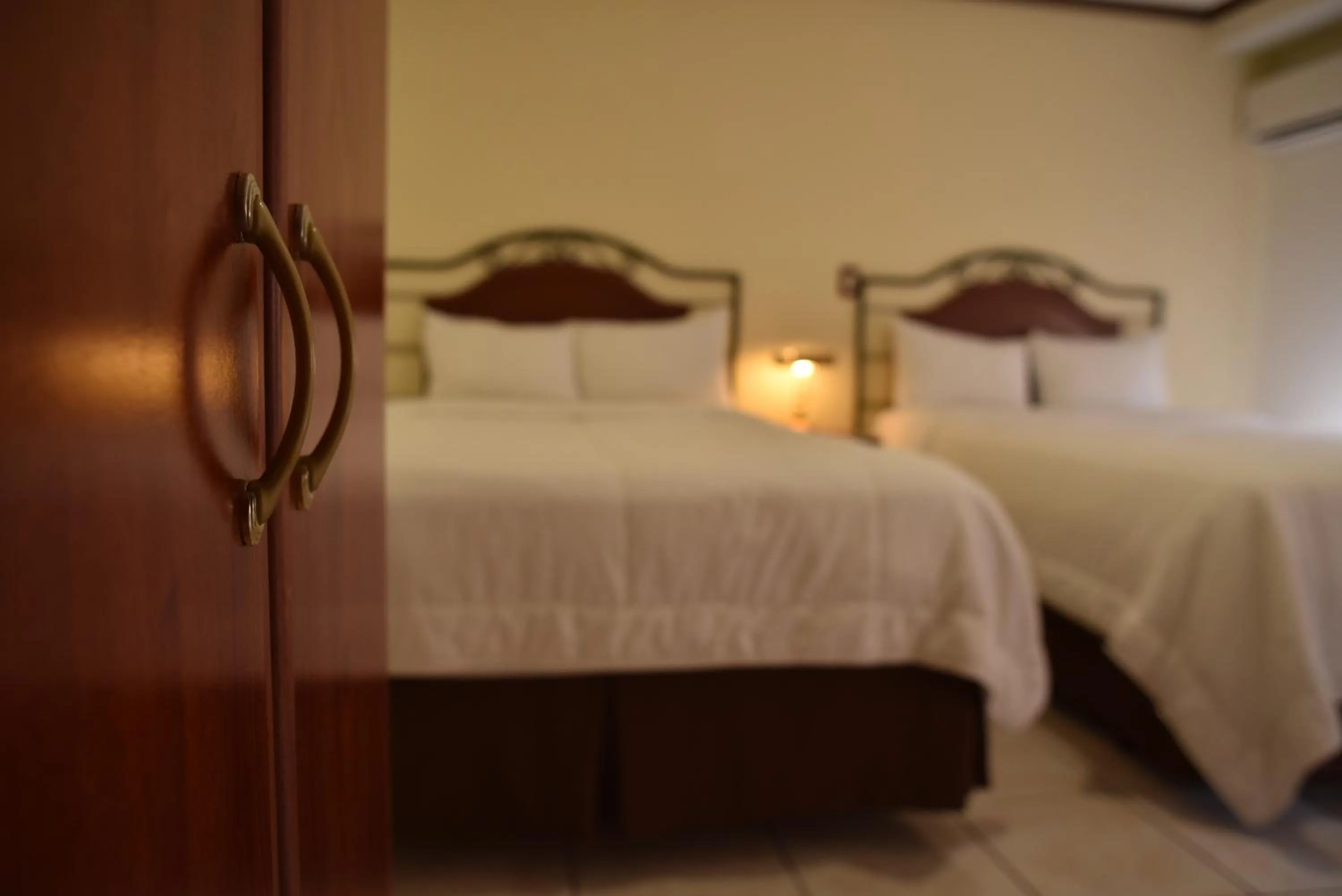 Bed in Hotel Gardenia Inn