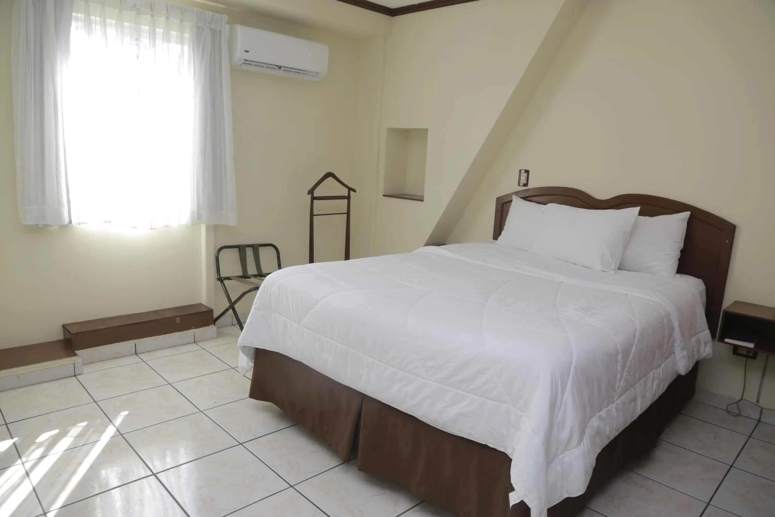 Bed in Hotel Gardenia Inn