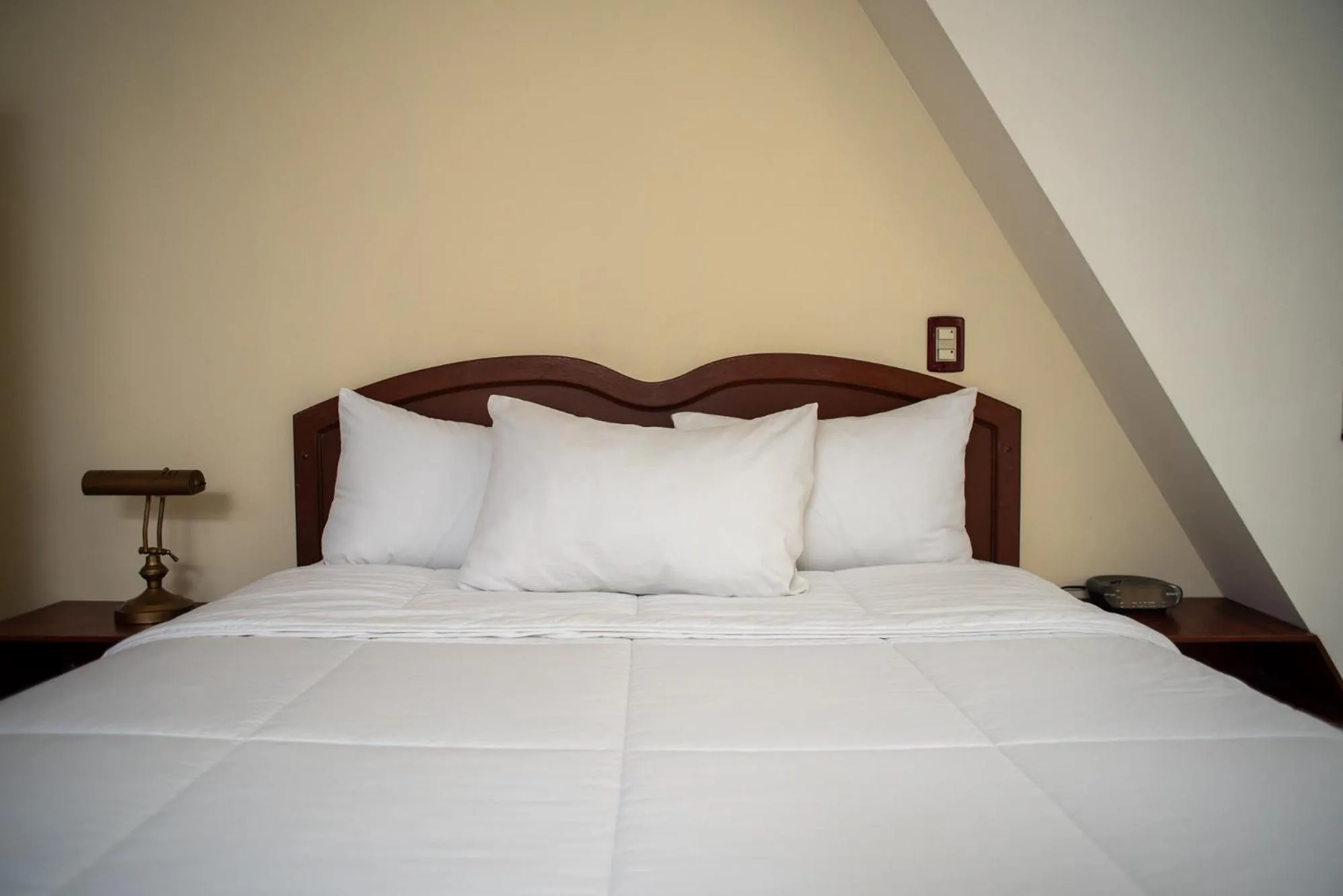 Bed in Hotel Gardenia Inn