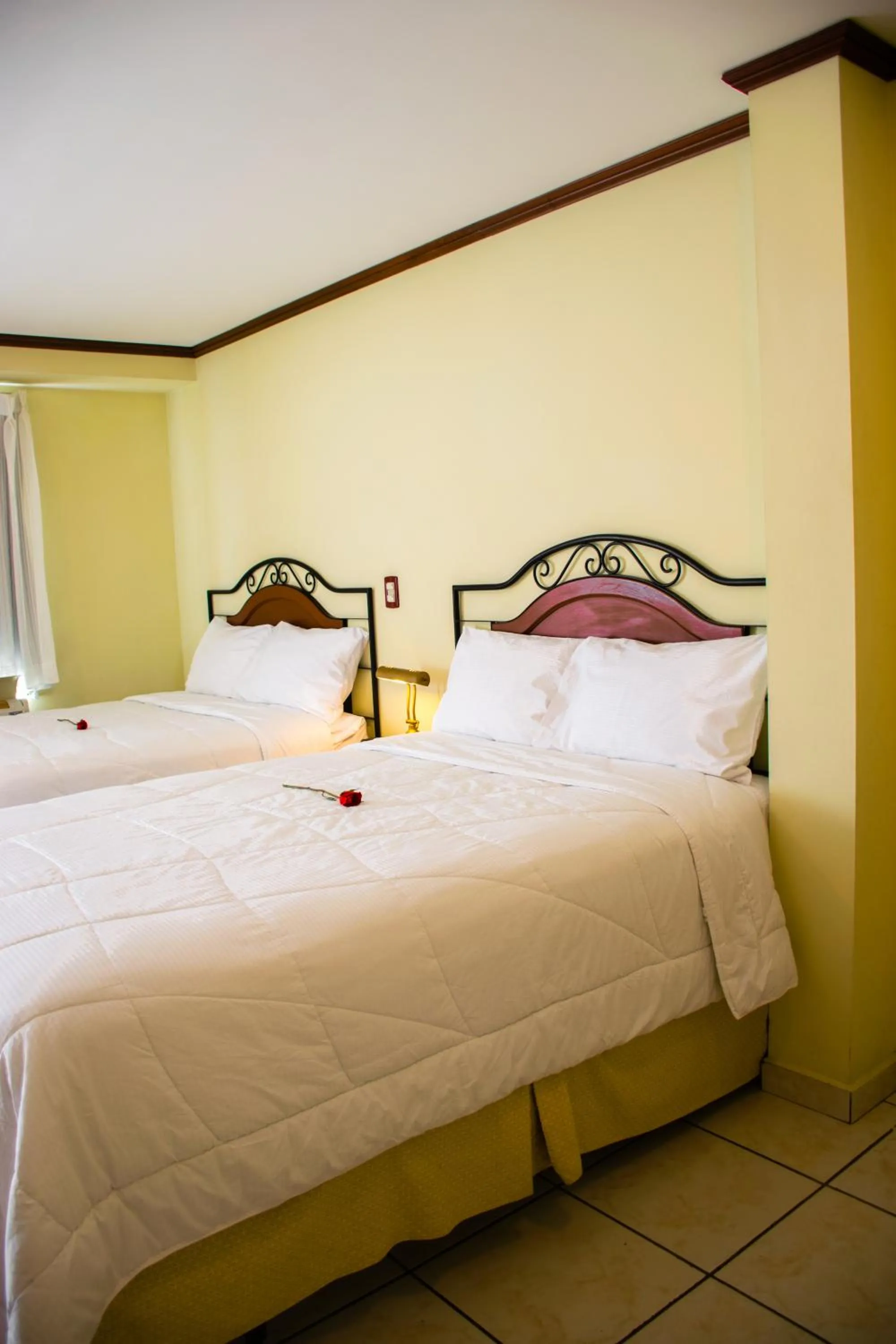 Bed in Hotel Gardenia Inn