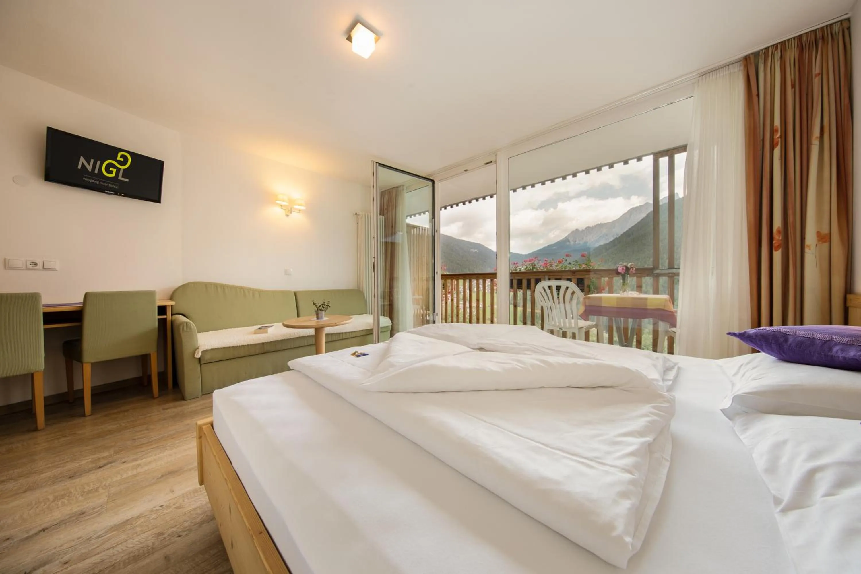 Photo of the whole room, Bed in Mounthotel Niggl