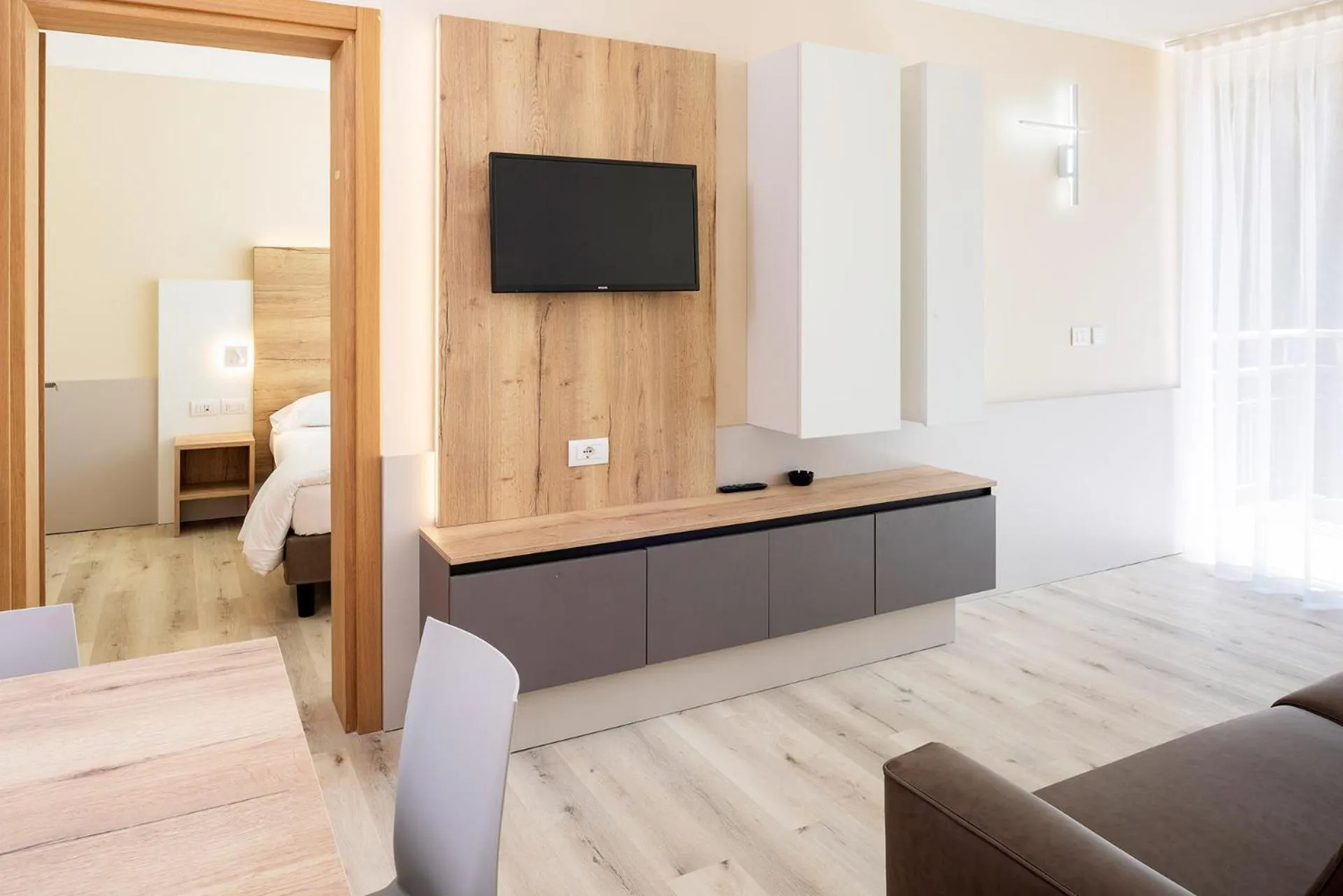 Living room, Bed in Residence Parco Del Garda