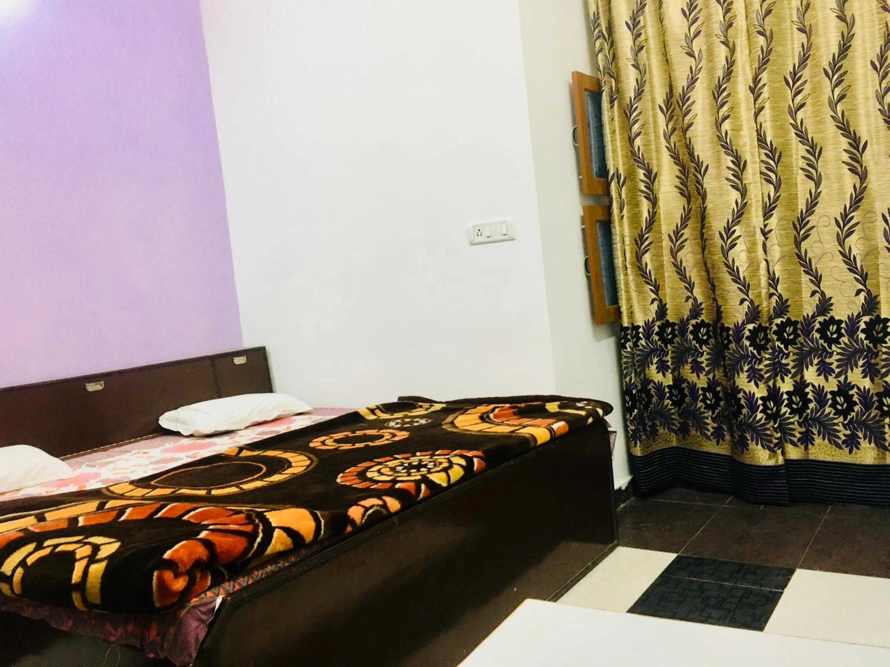 Bed in Hotel Heritage Sanyam