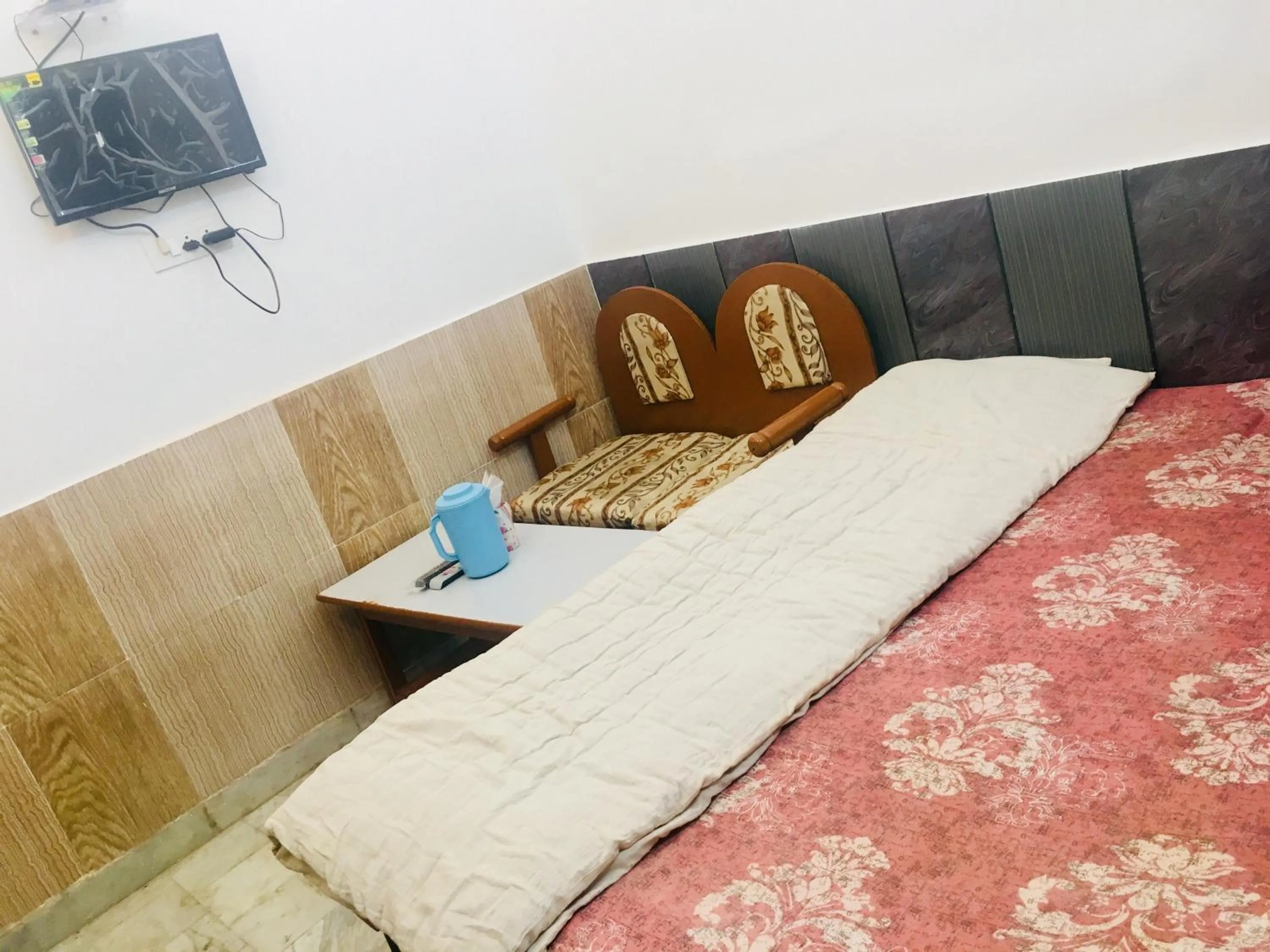 Bed in Hotel Heritage Sanyam