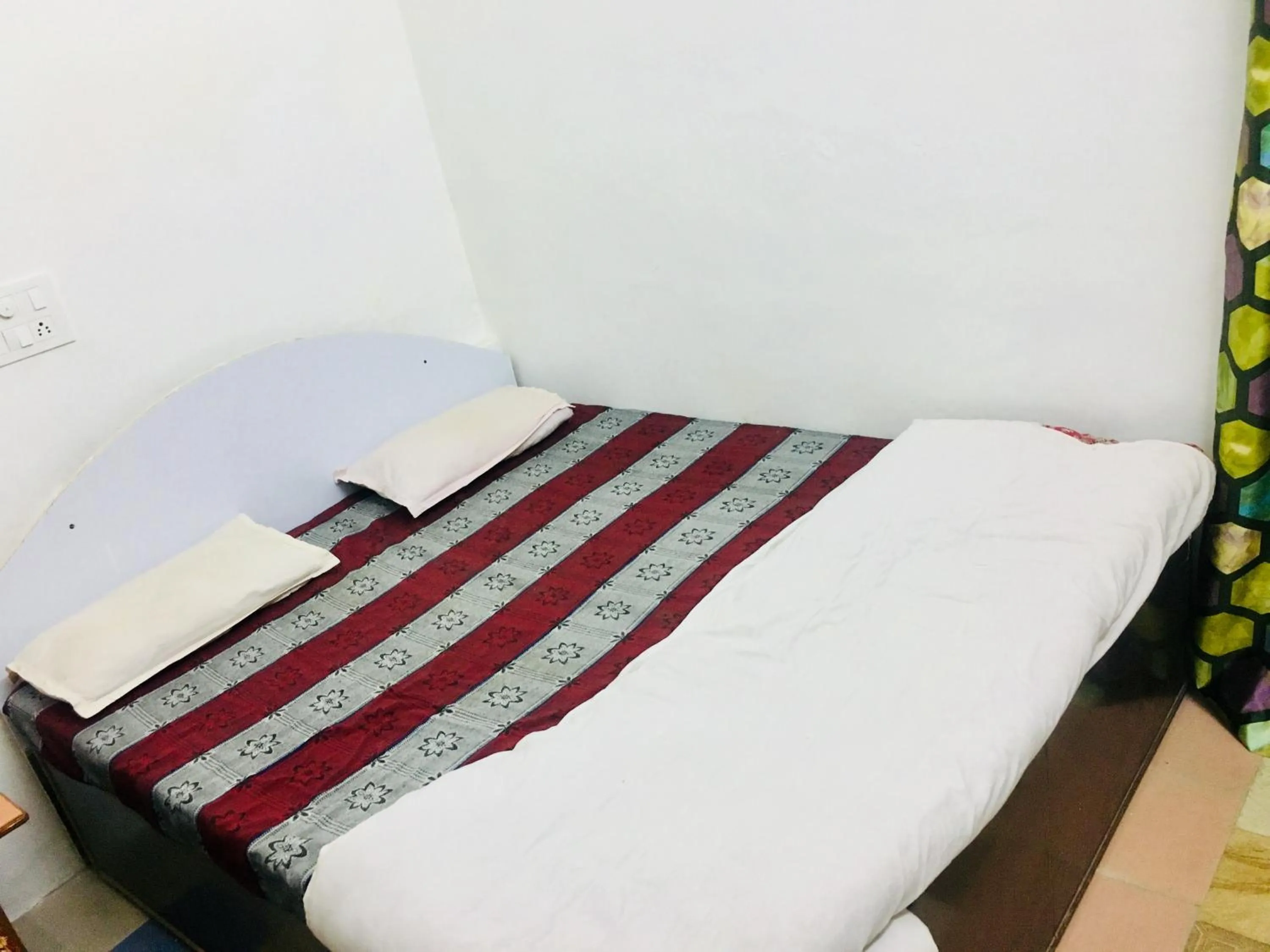 Bed in Hotel Heritage Sanyam