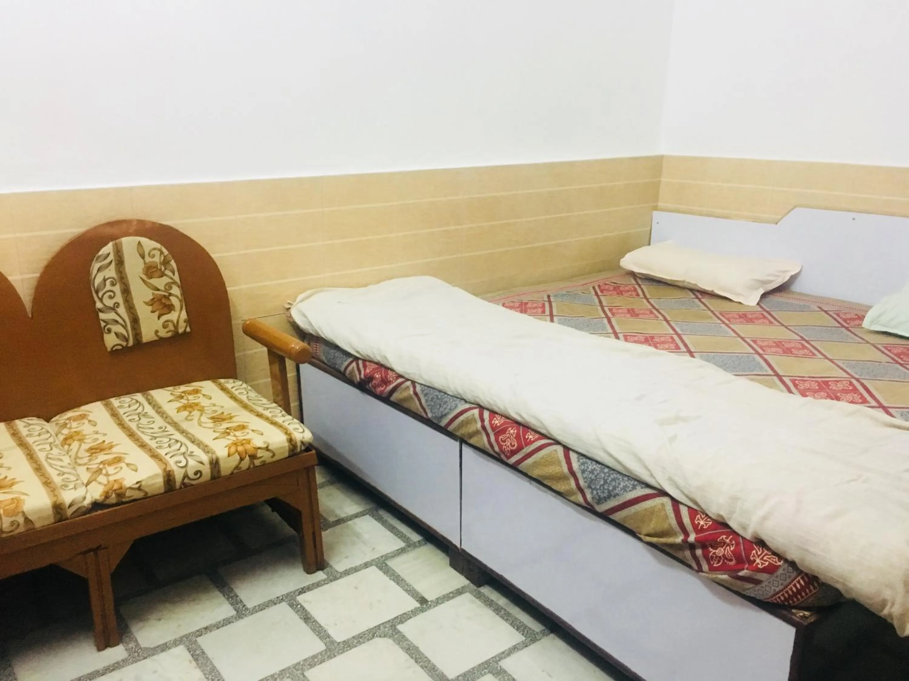 Bed in Hotel Heritage Sanyam