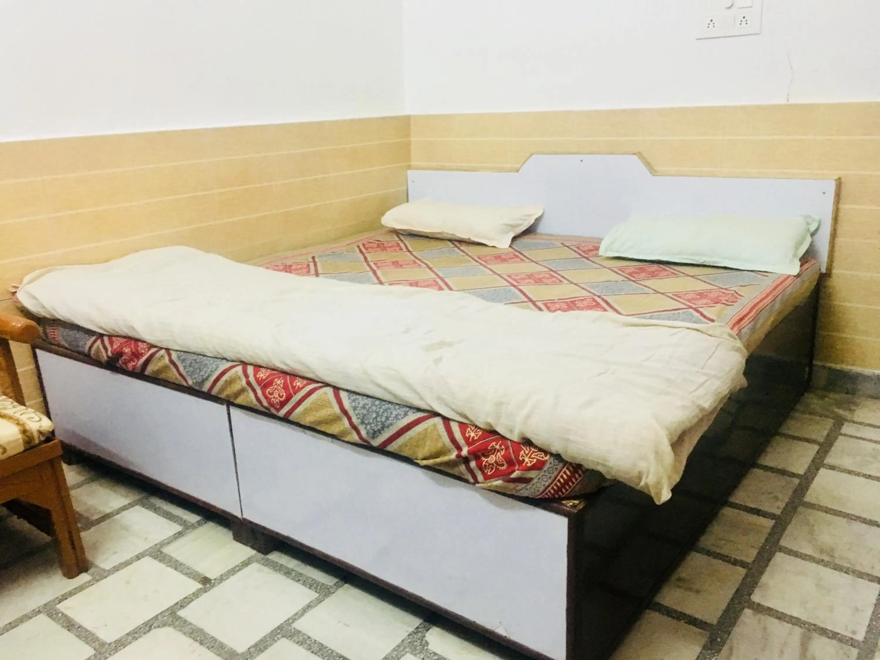 Bed in Hotel Heritage Sanyam