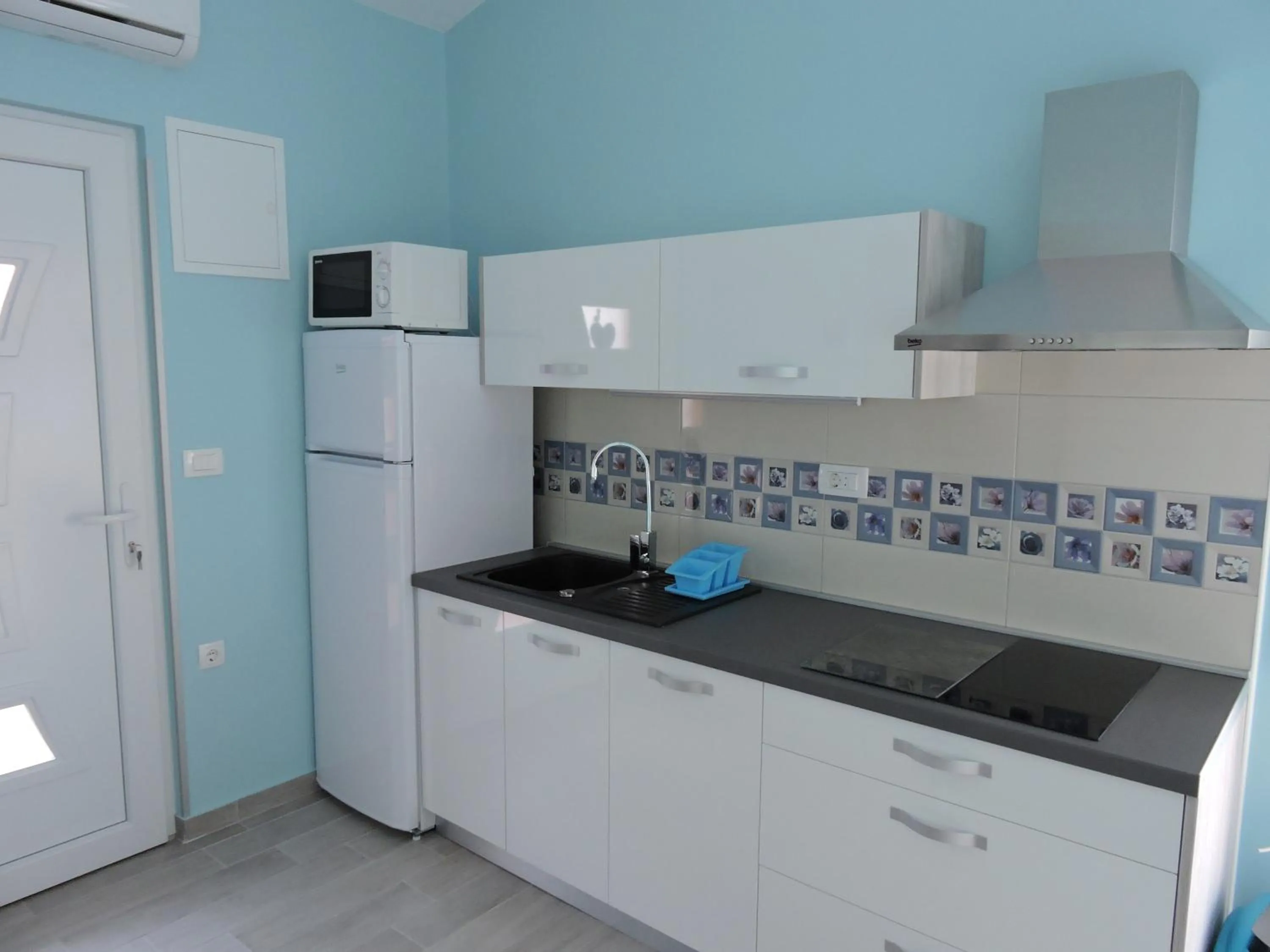 Kitchen or kitchenette in Apartments Perla