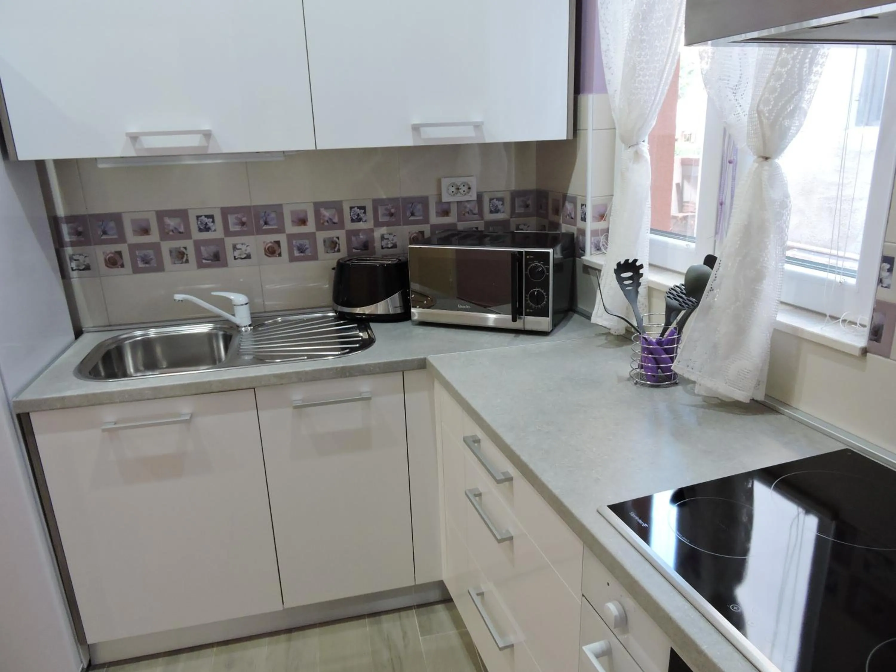 Kitchen or kitchenette in Apartments Perla
