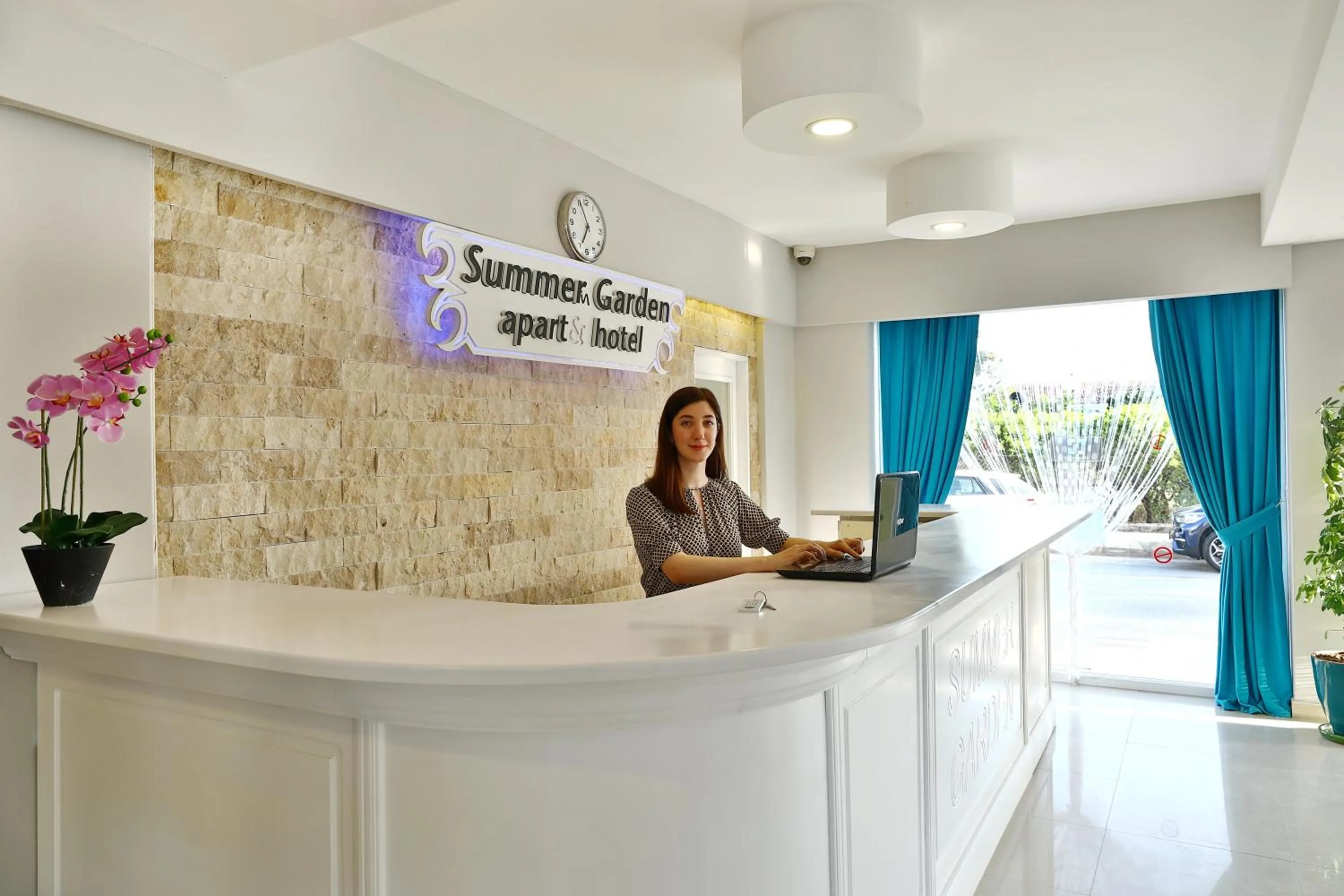 Lobby or reception in Summer Garden Suites Beach Hotel