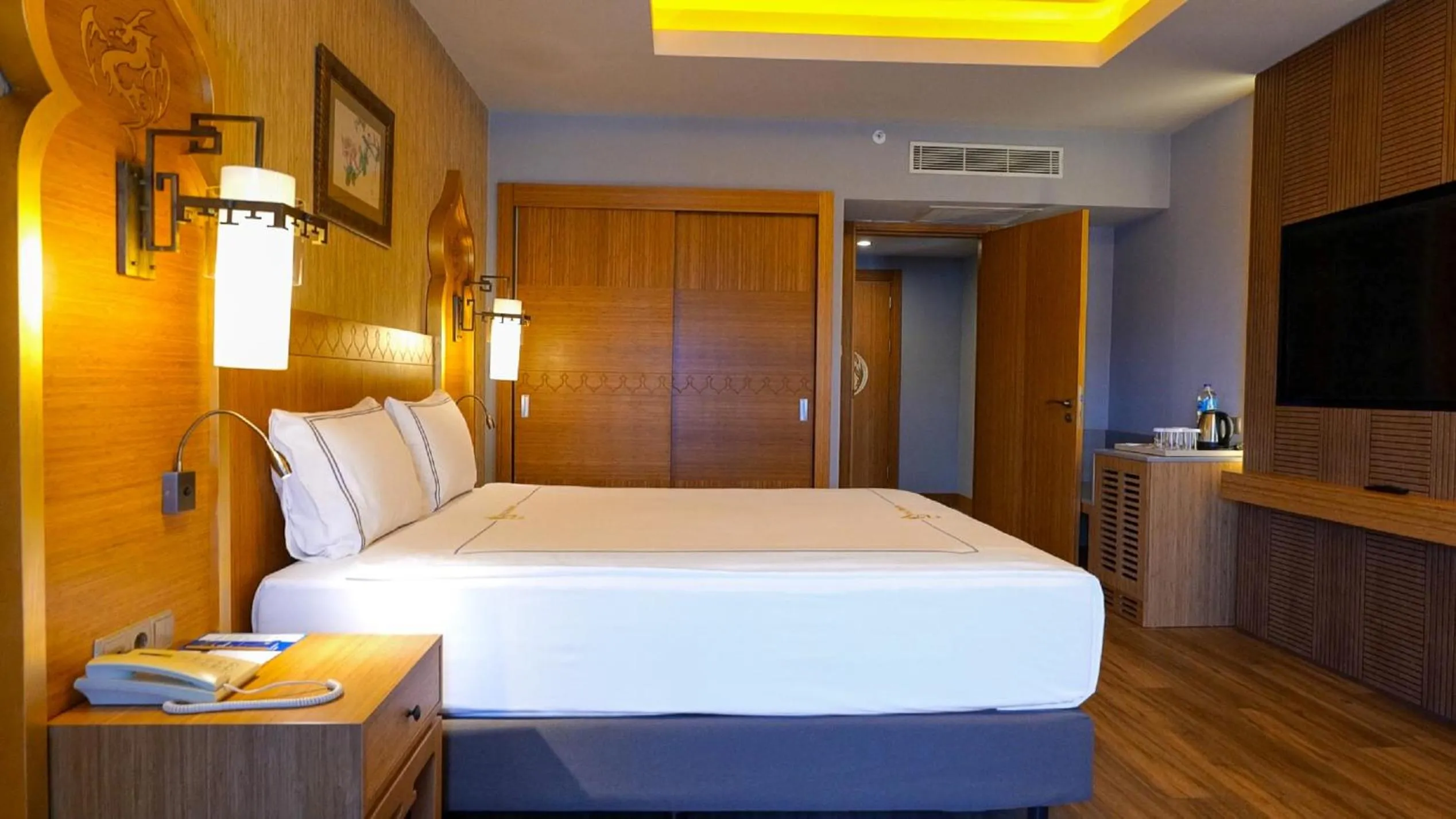 Bed in Royal Dragon Hotel