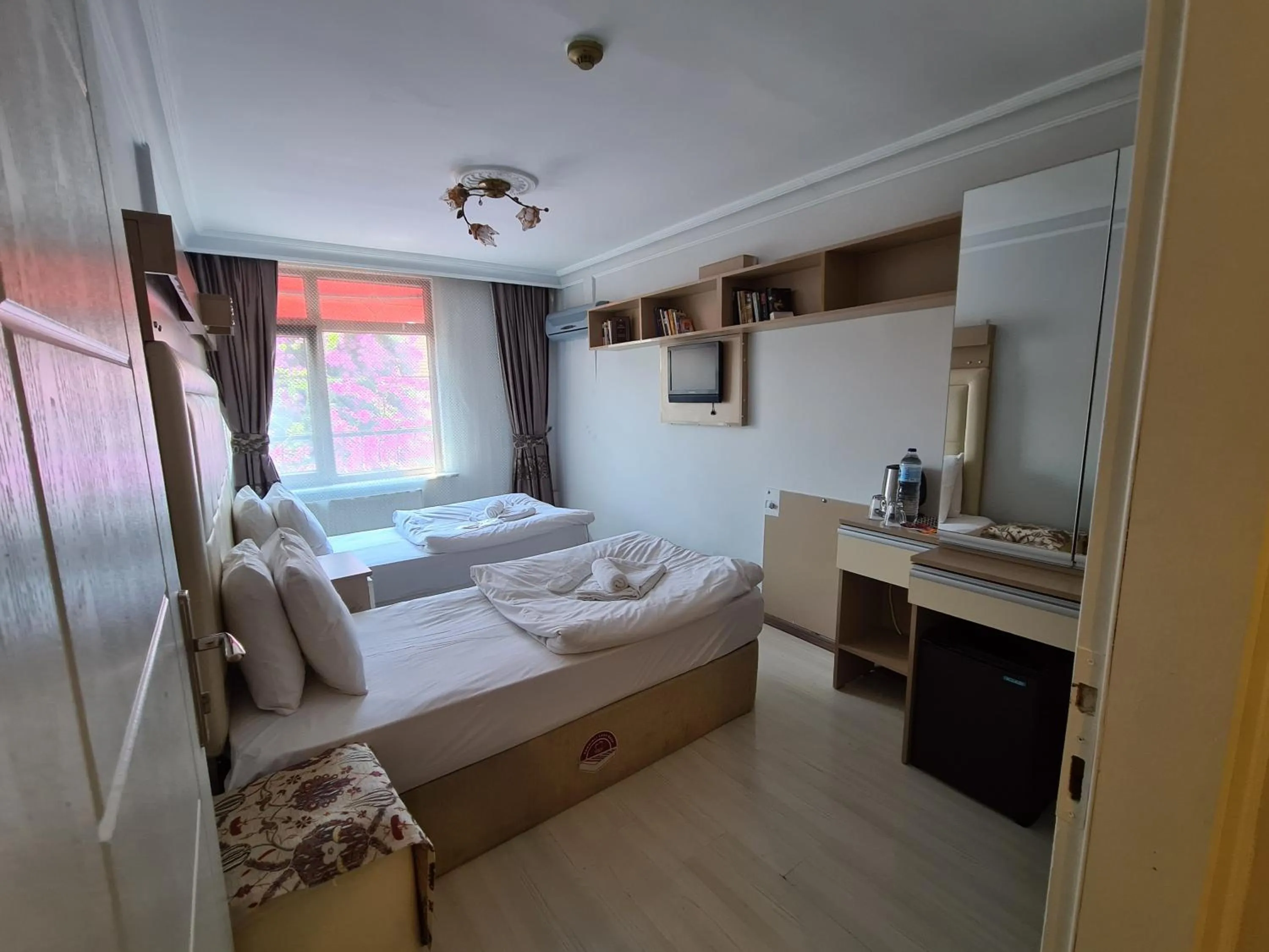 Bed in Oceans 7 Hotel