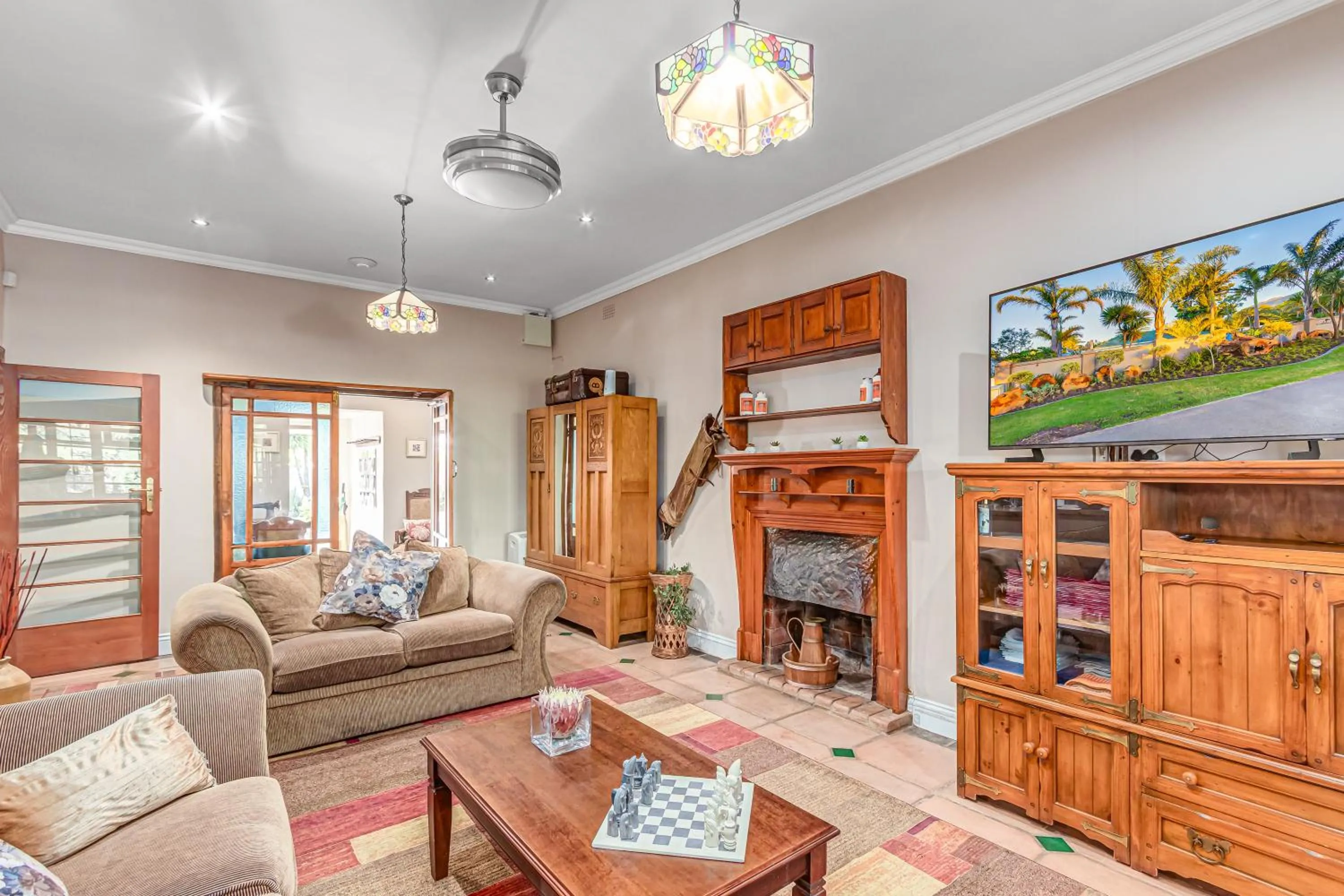 Communal lounge/ TV room in Caledon 23 Guest House