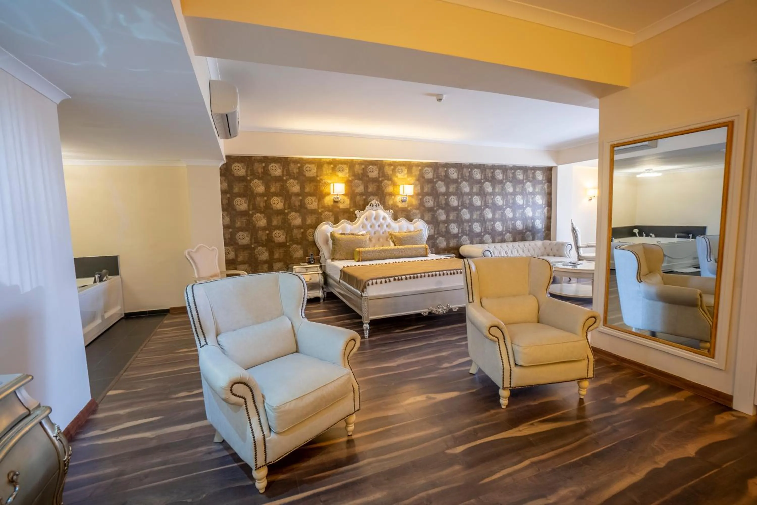 Seating area, Bed in Azka Hotel