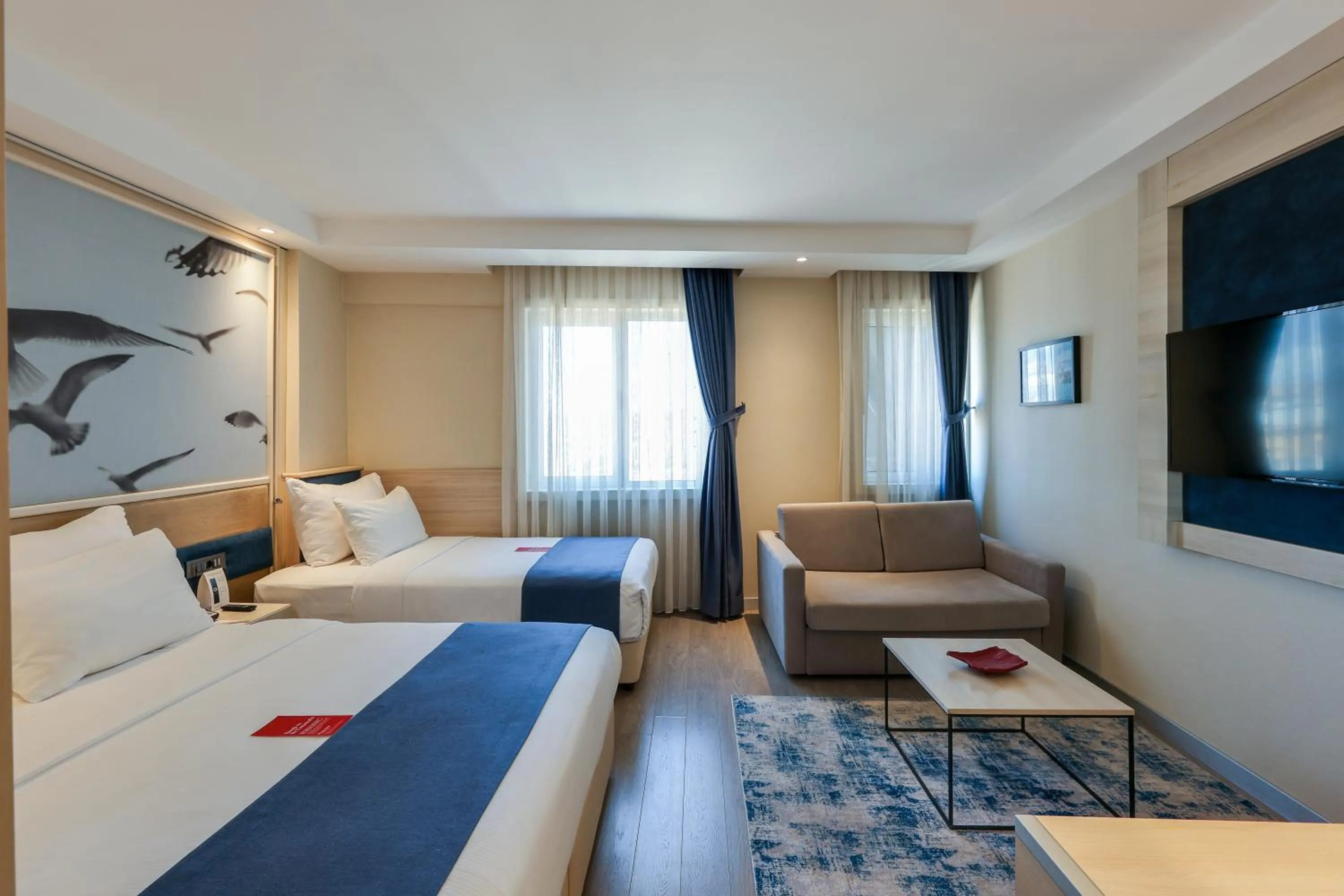 Communal lounge/ TV room, Bed in Ramada by Wyndham Istanbul Old City