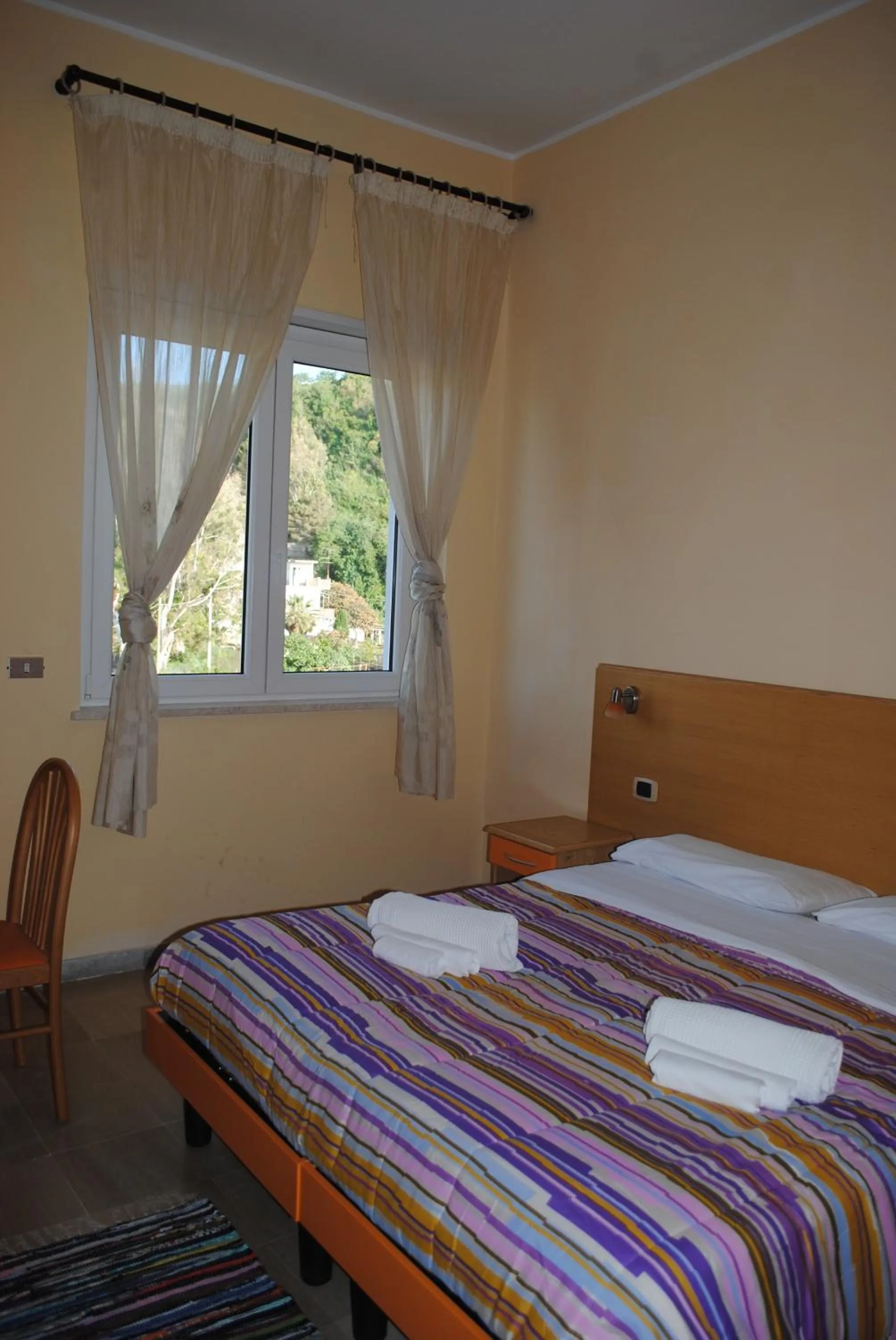 Bed in Hotel South Paradise