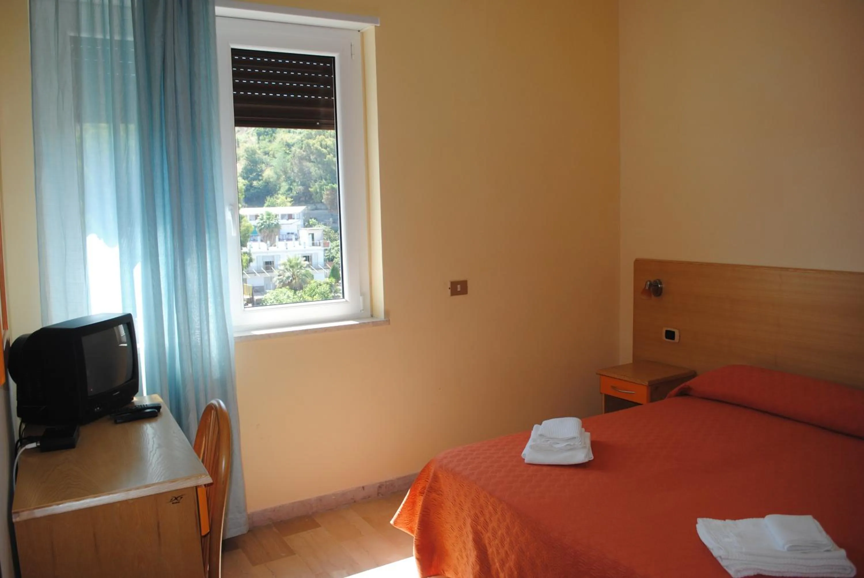 Bed in Hotel South Paradise