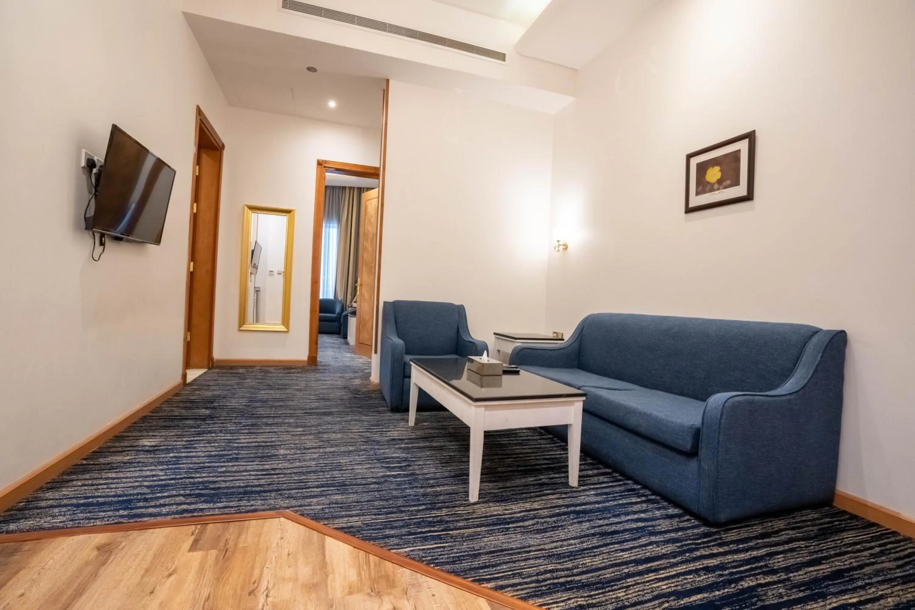 Communal lounge/ TV room in Platinum Al Khamseen Serviced Apartments