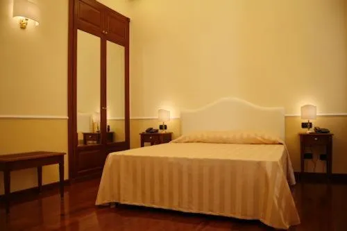 Bed in Luxury Ludovisi Rooms