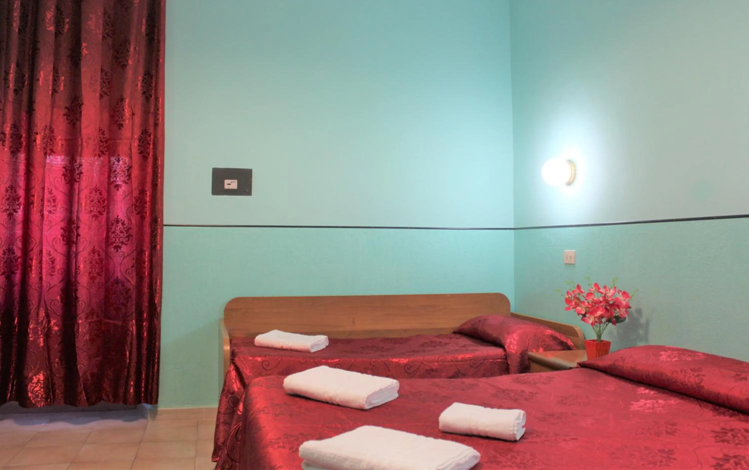 Bed in Hotel Eurorooms