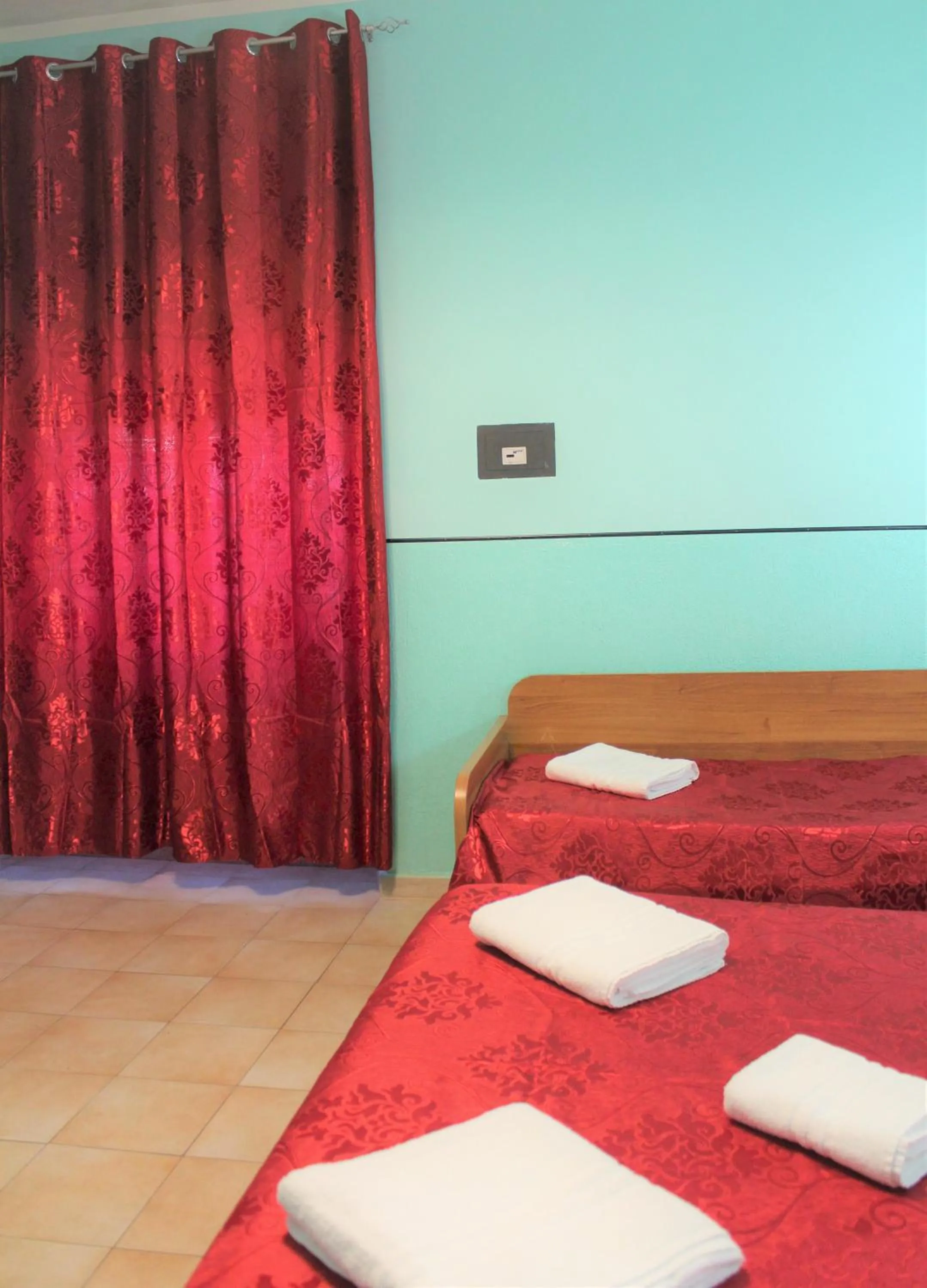 Bed in Hotel Eurorooms