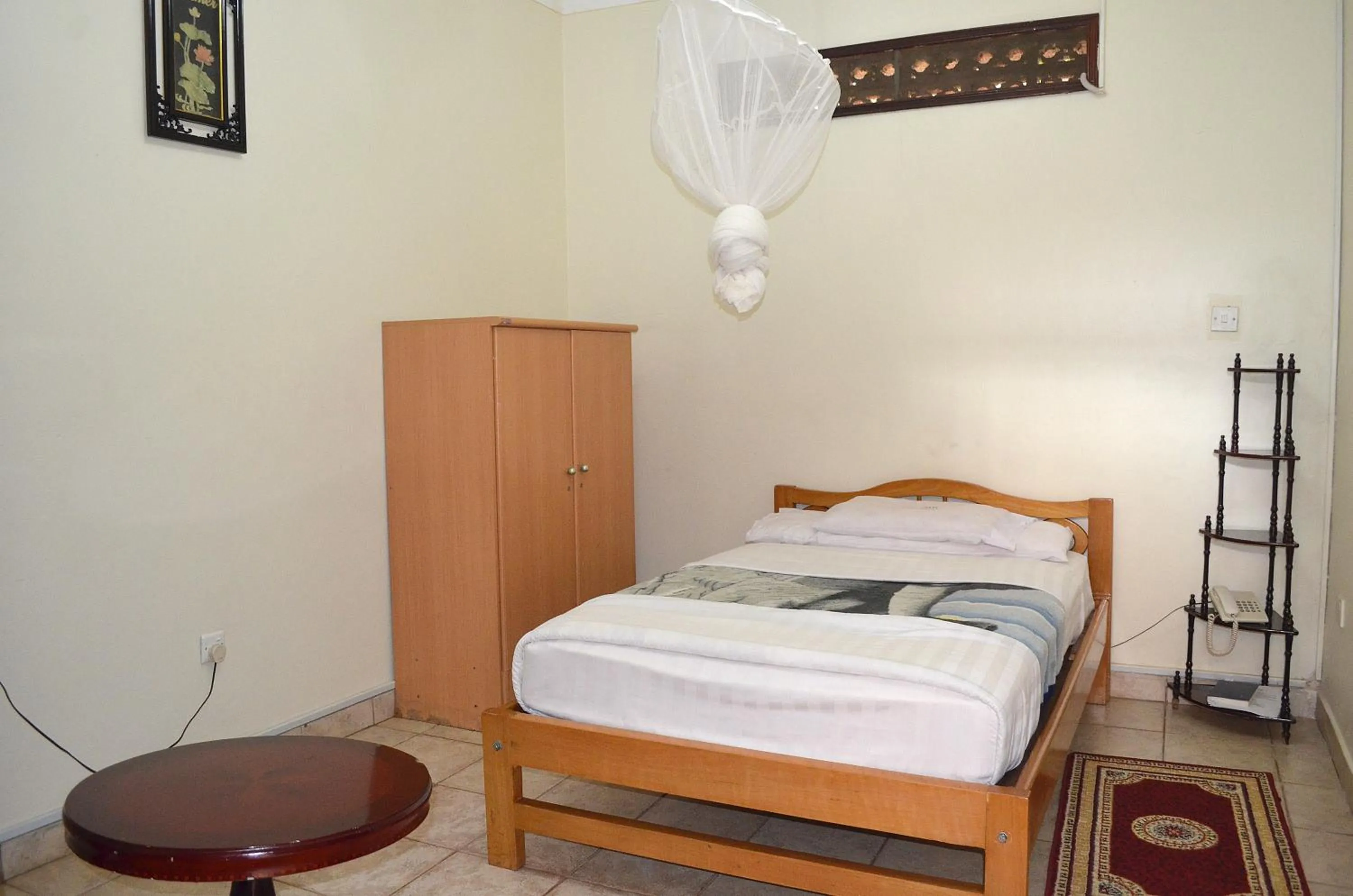 Bedroom in Victoria Travel Hotel